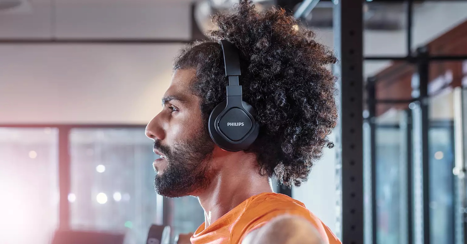 man wearing headphones gym