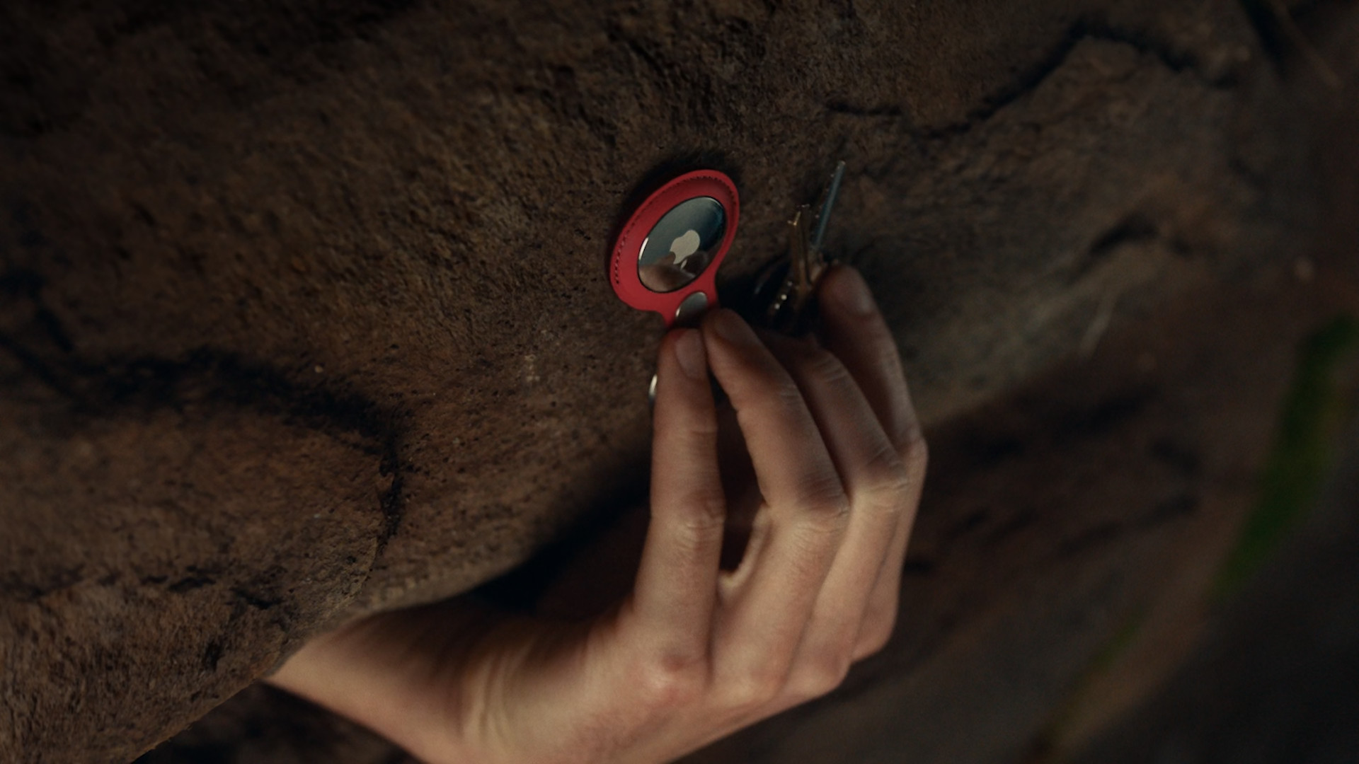 hand attaching tracker to surface