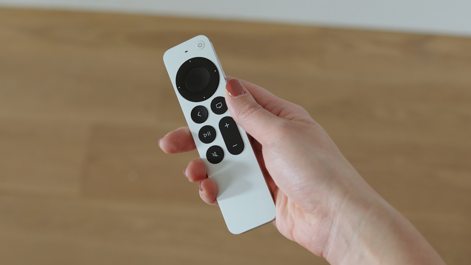 hand holding remote back