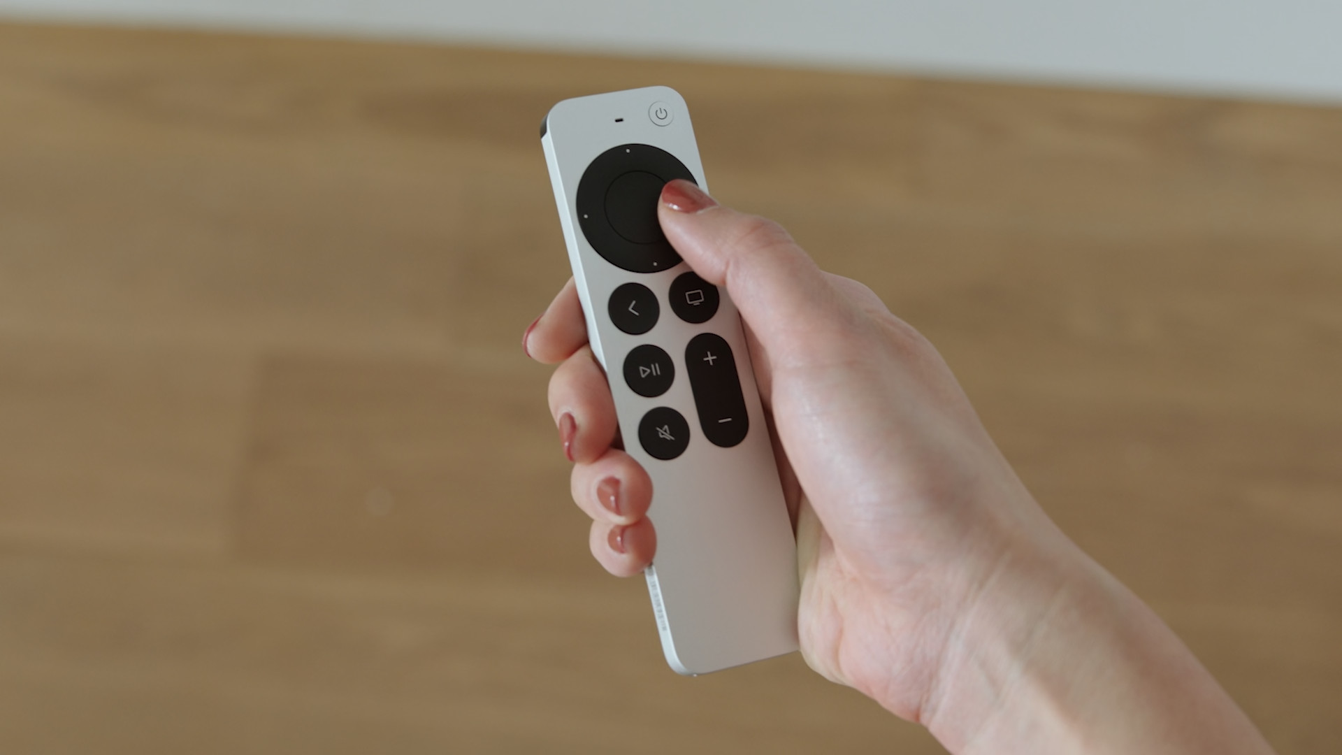 hand holding remote front