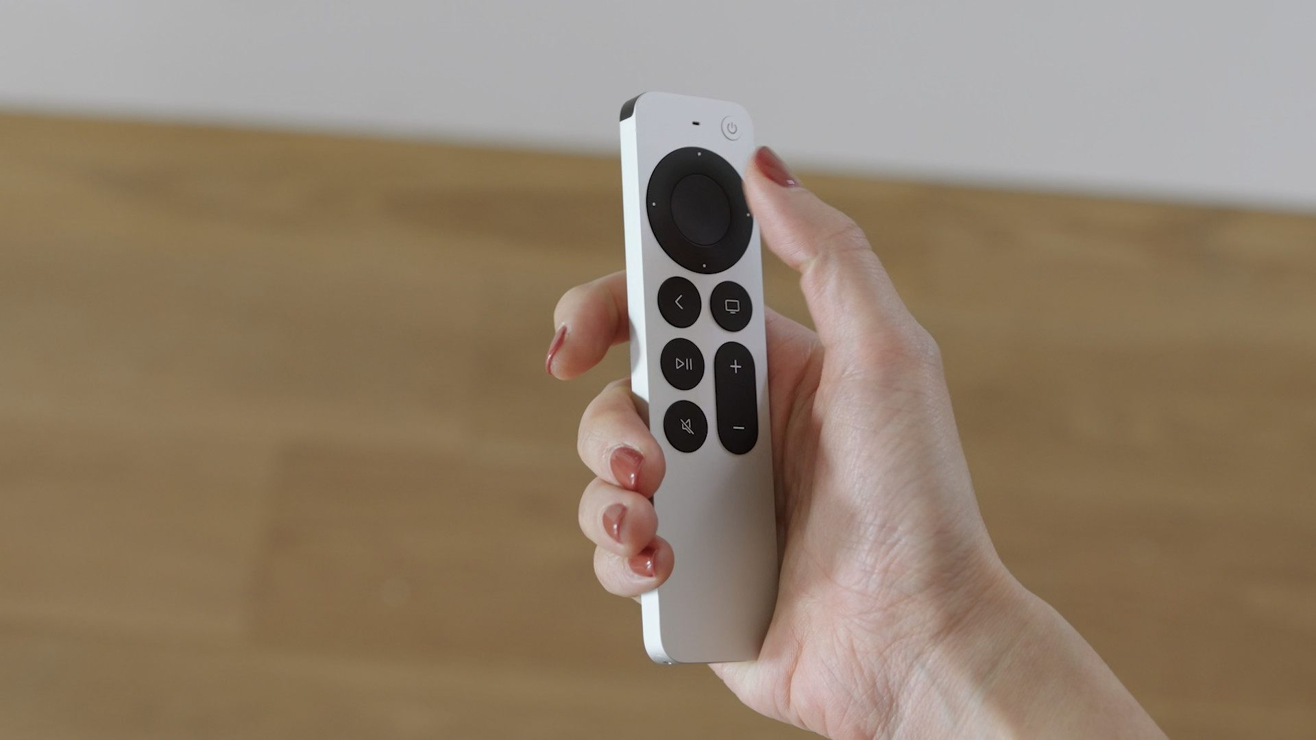 hand holding remote side