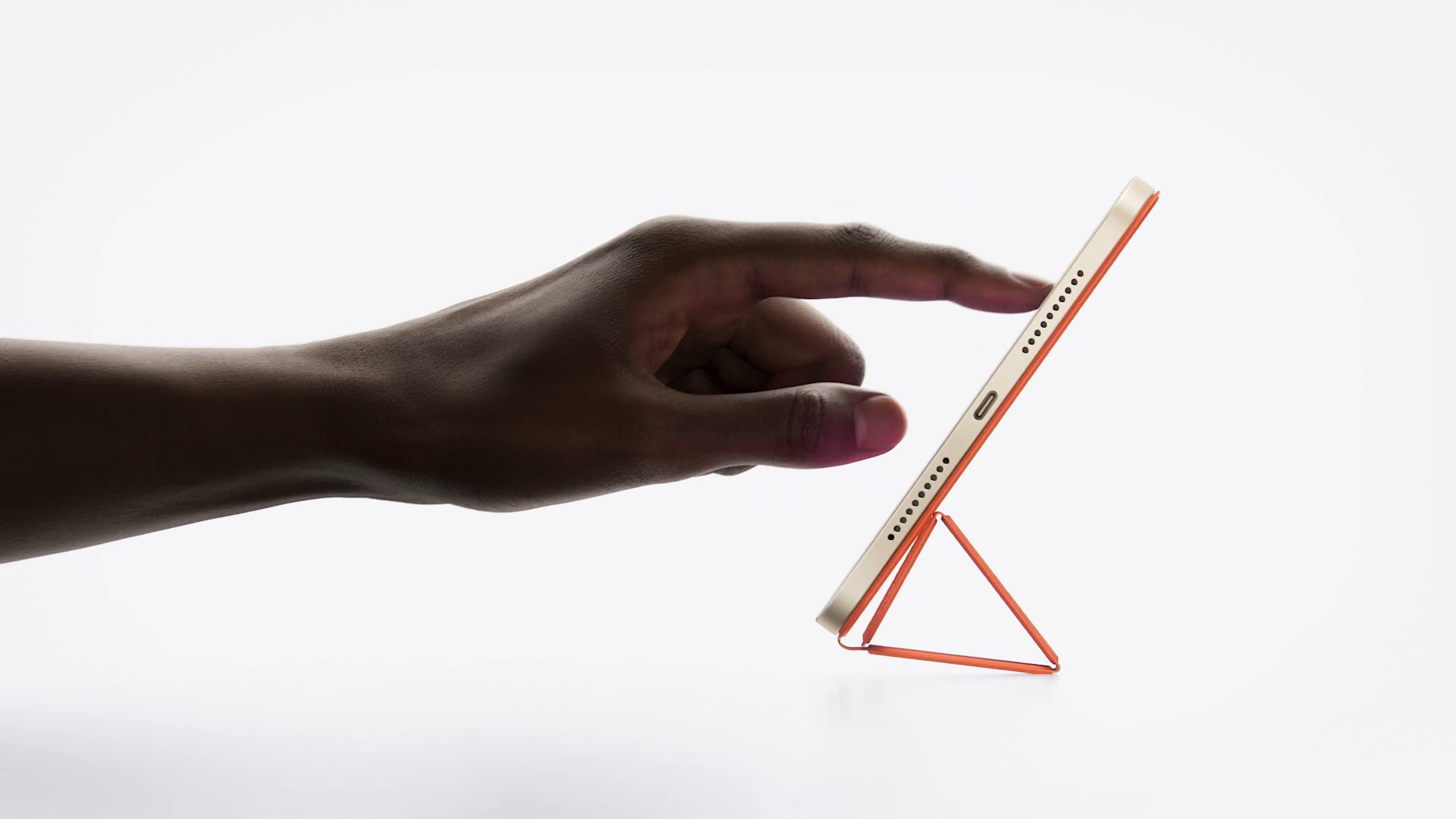 hand touching tablet side view