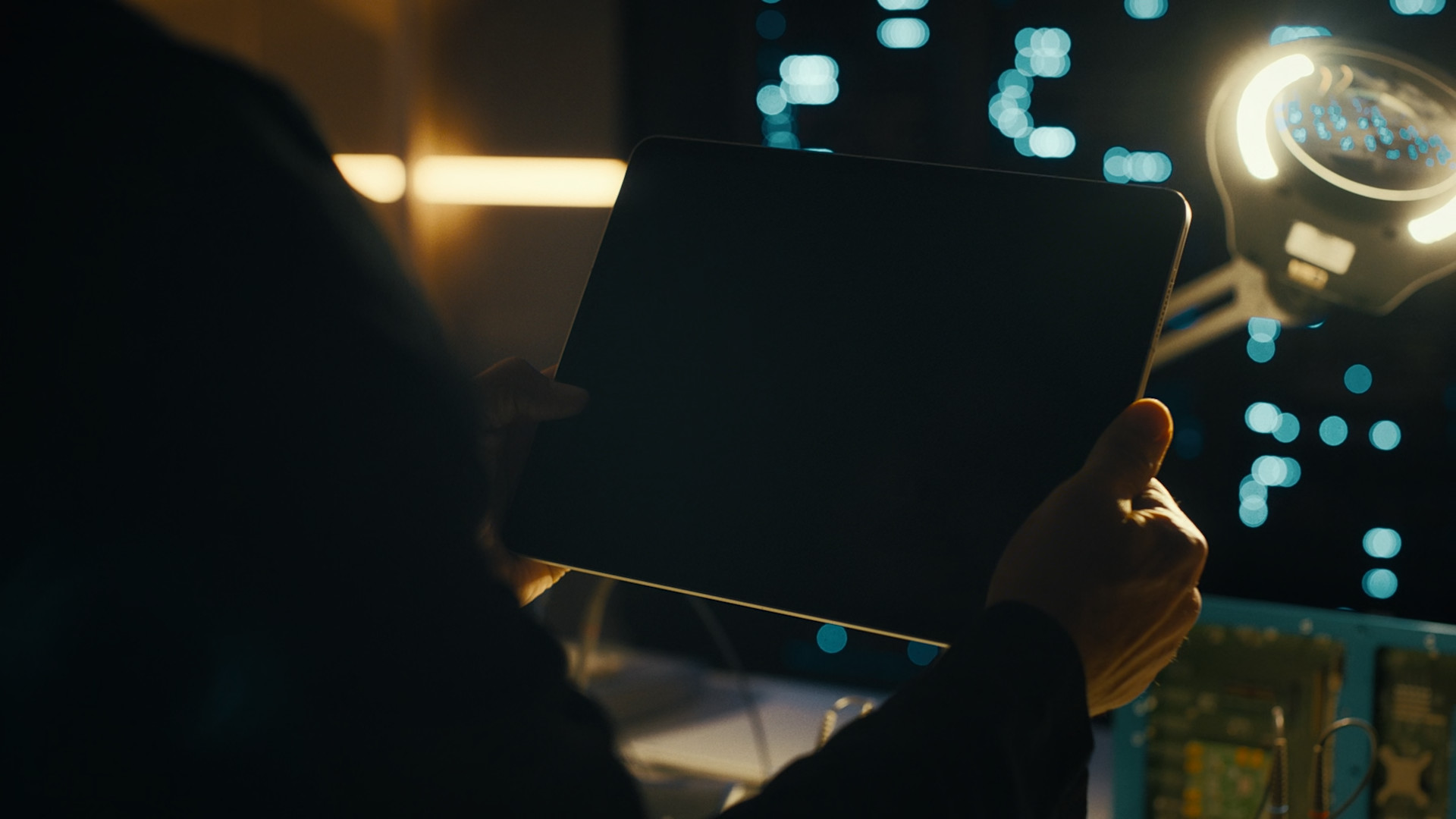 holding tablet dark room