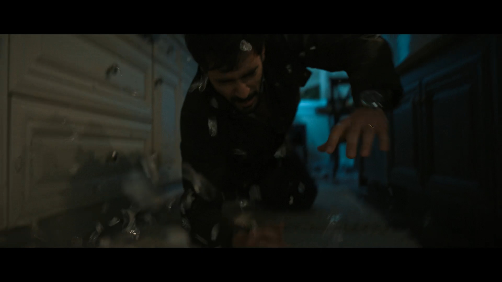 man falling in kitchen