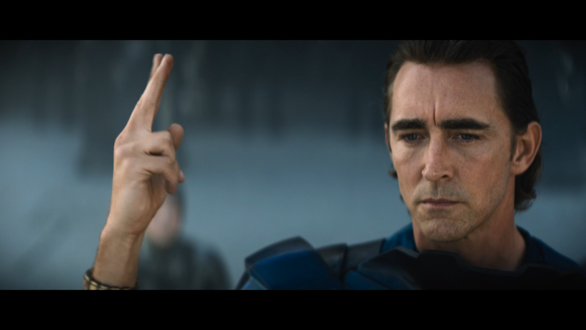 man gesturing outdoors