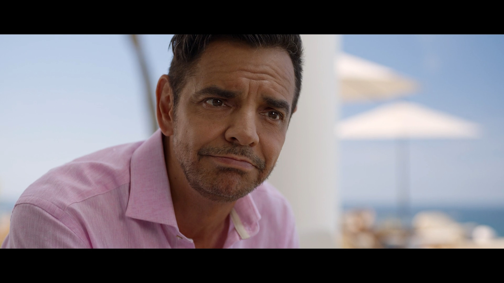 man in pink shirt outdoors