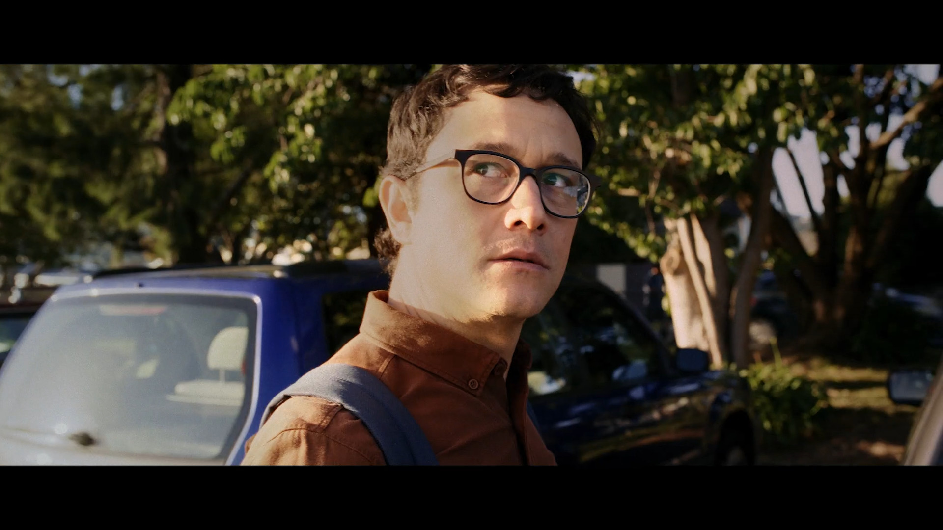 man with glasses outdoors