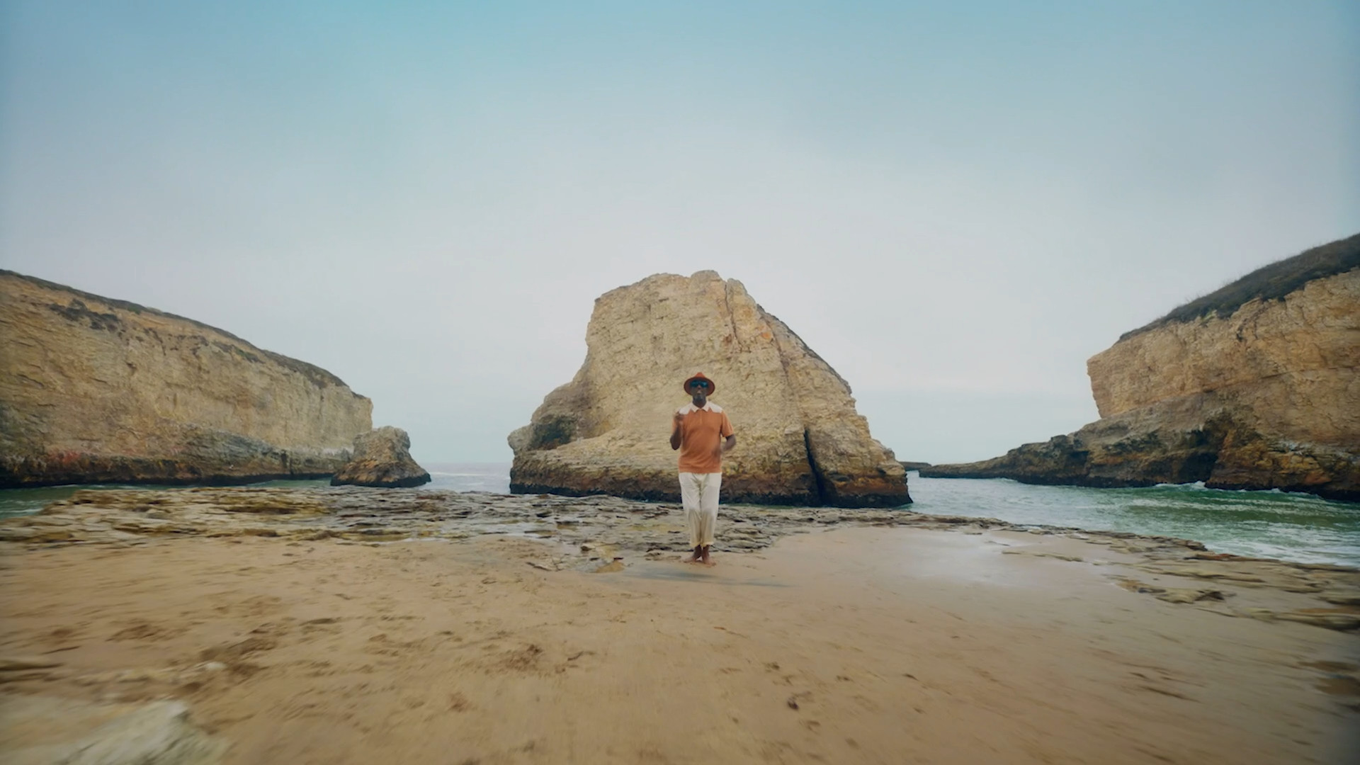 person beach rock formations