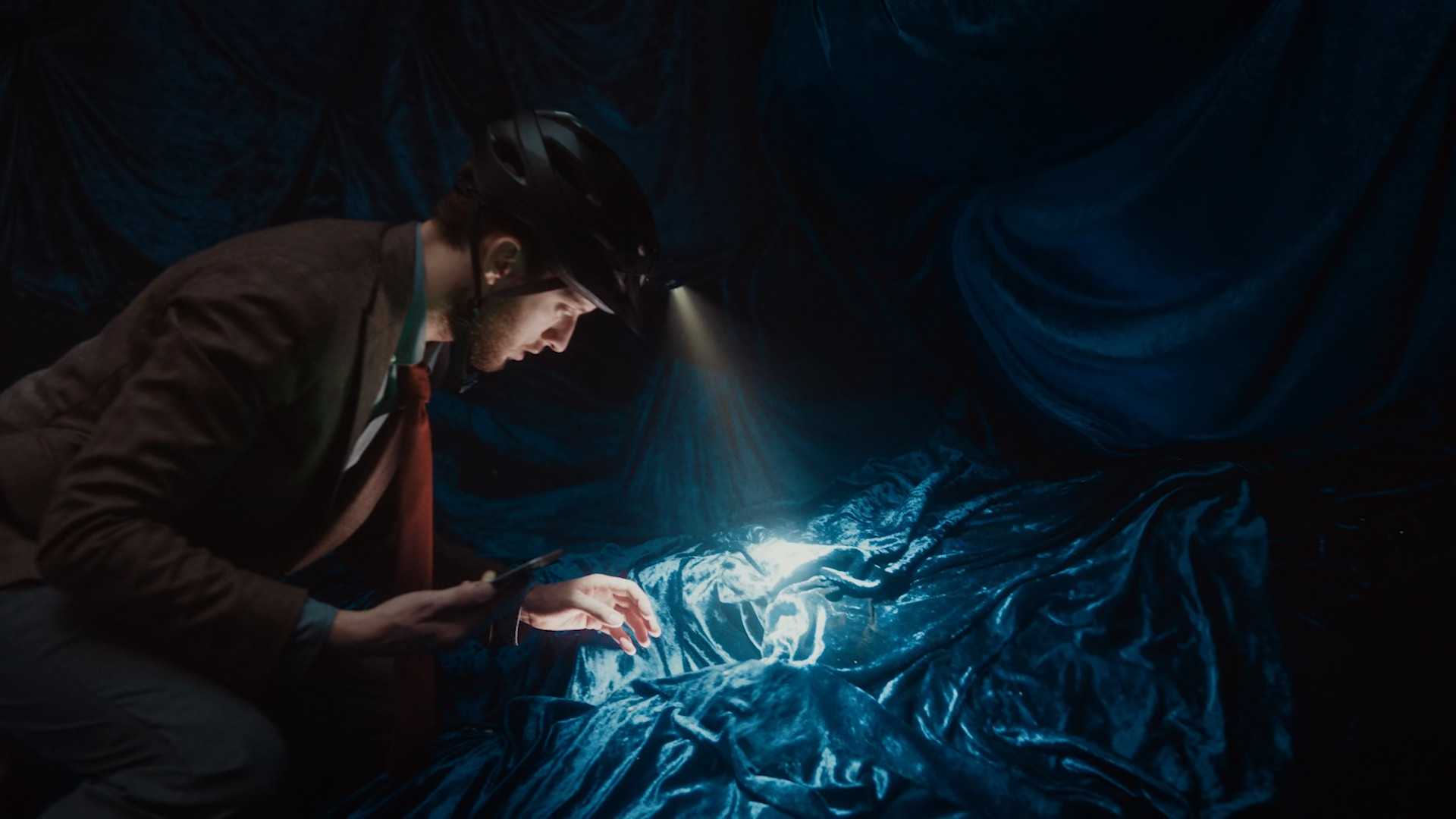 person finding object in cave