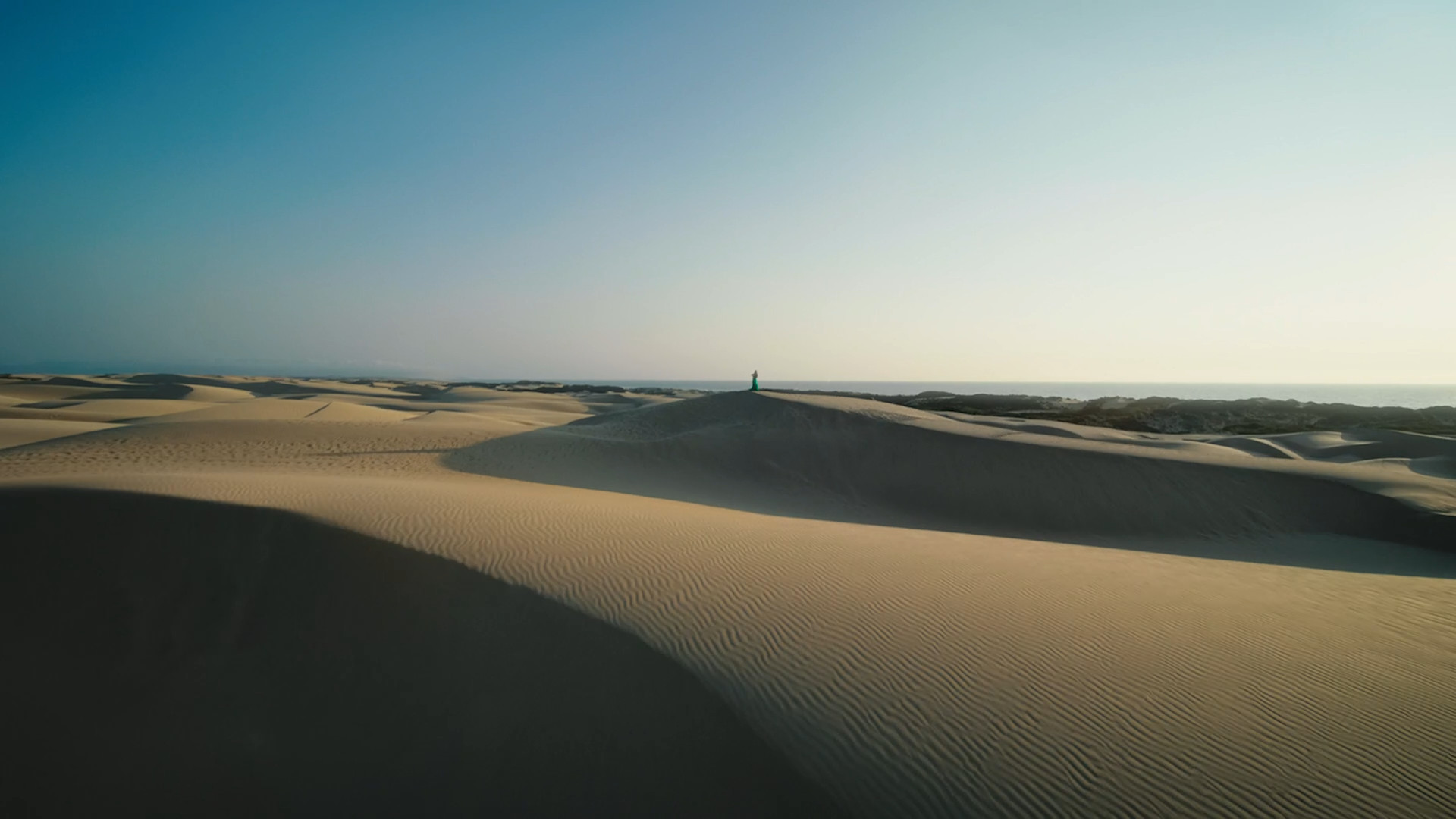 person in desert dunes