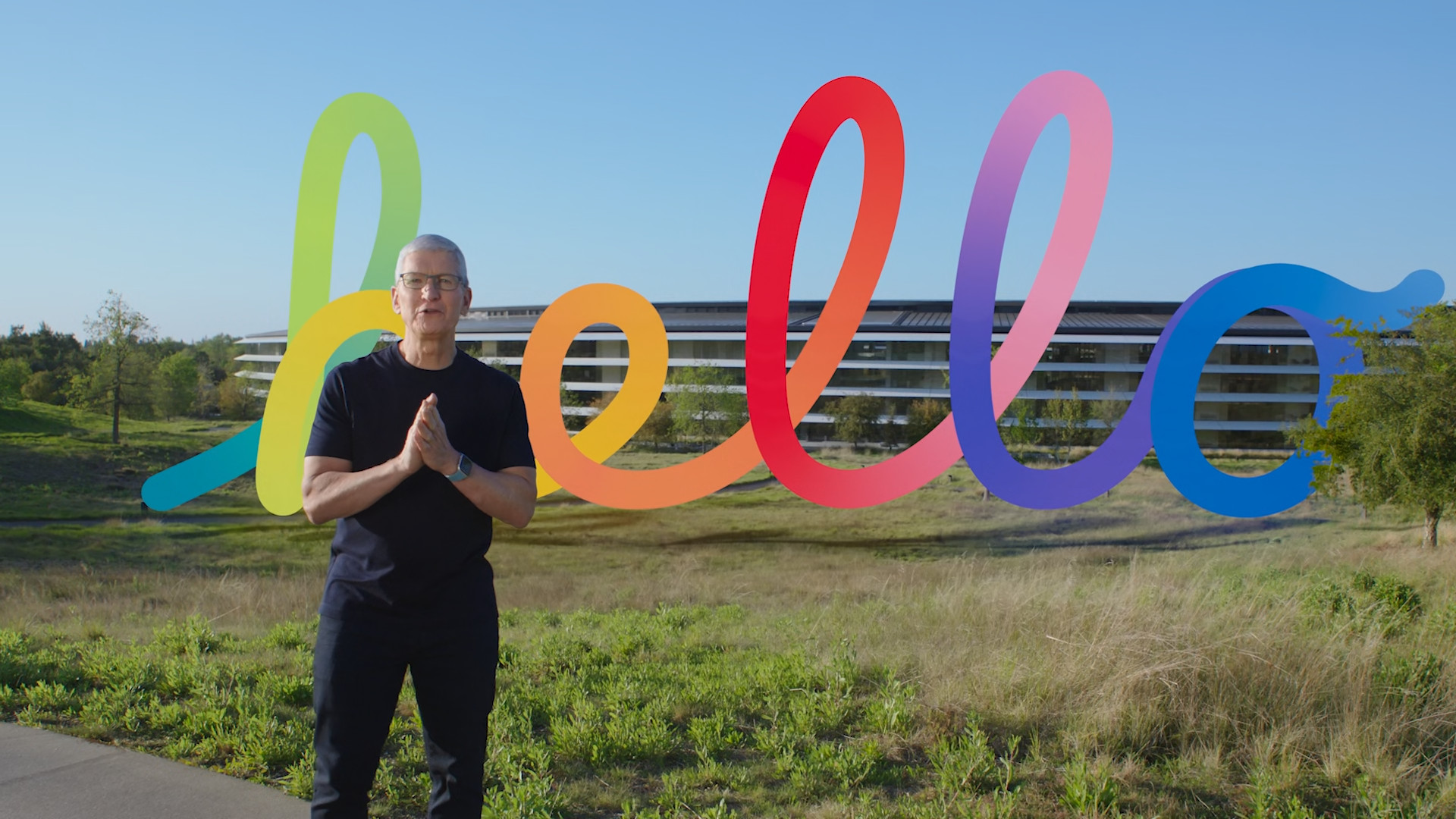 person in front of colorful hello sign