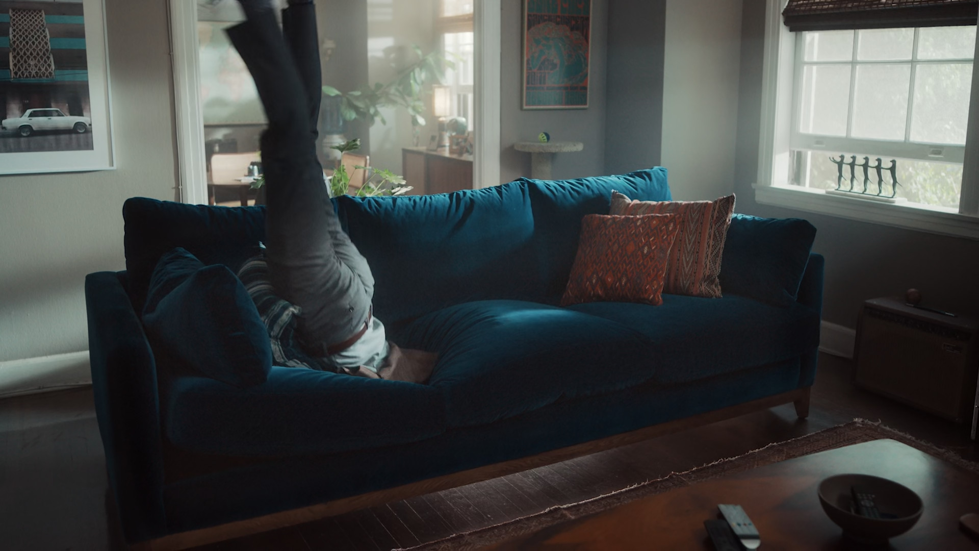person upside down on couch