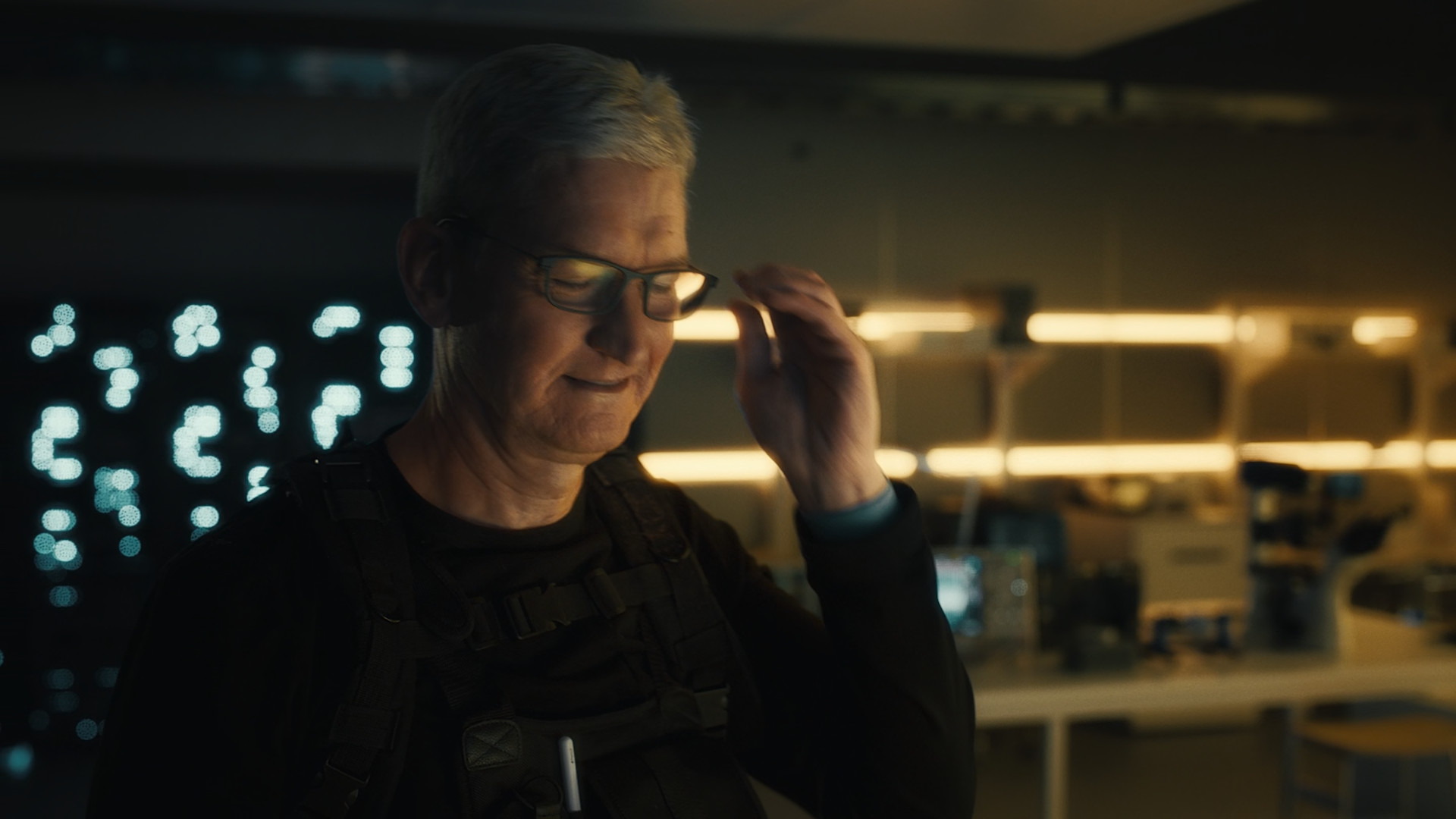 person wearing glasses dark room