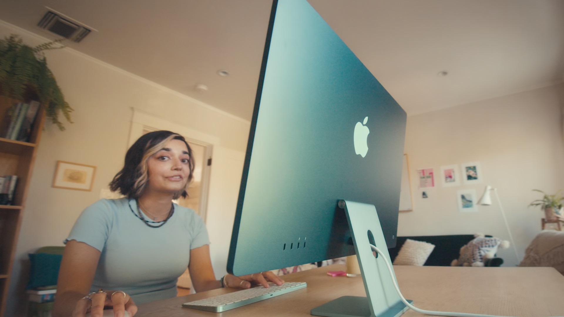 person working on apple desktop