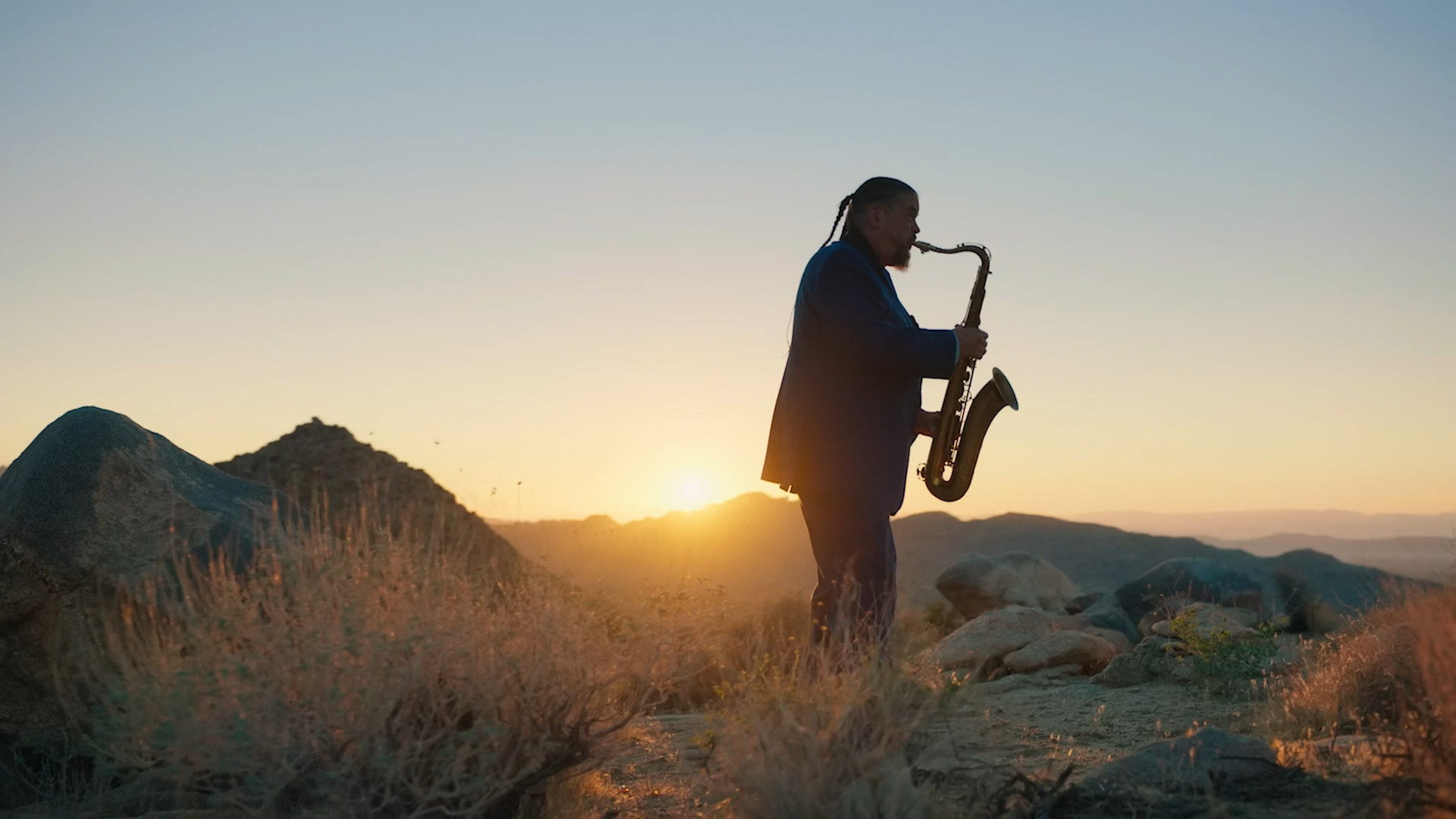 saxophonist desert sunset