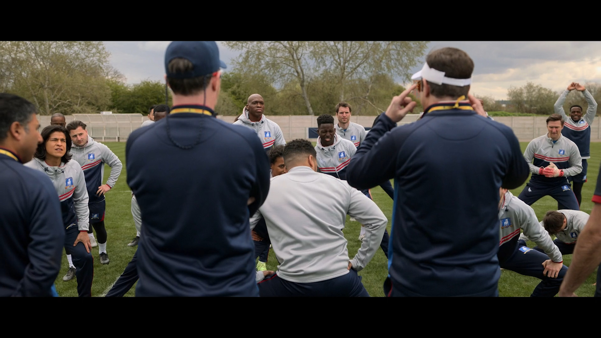 team huddle on soccer field