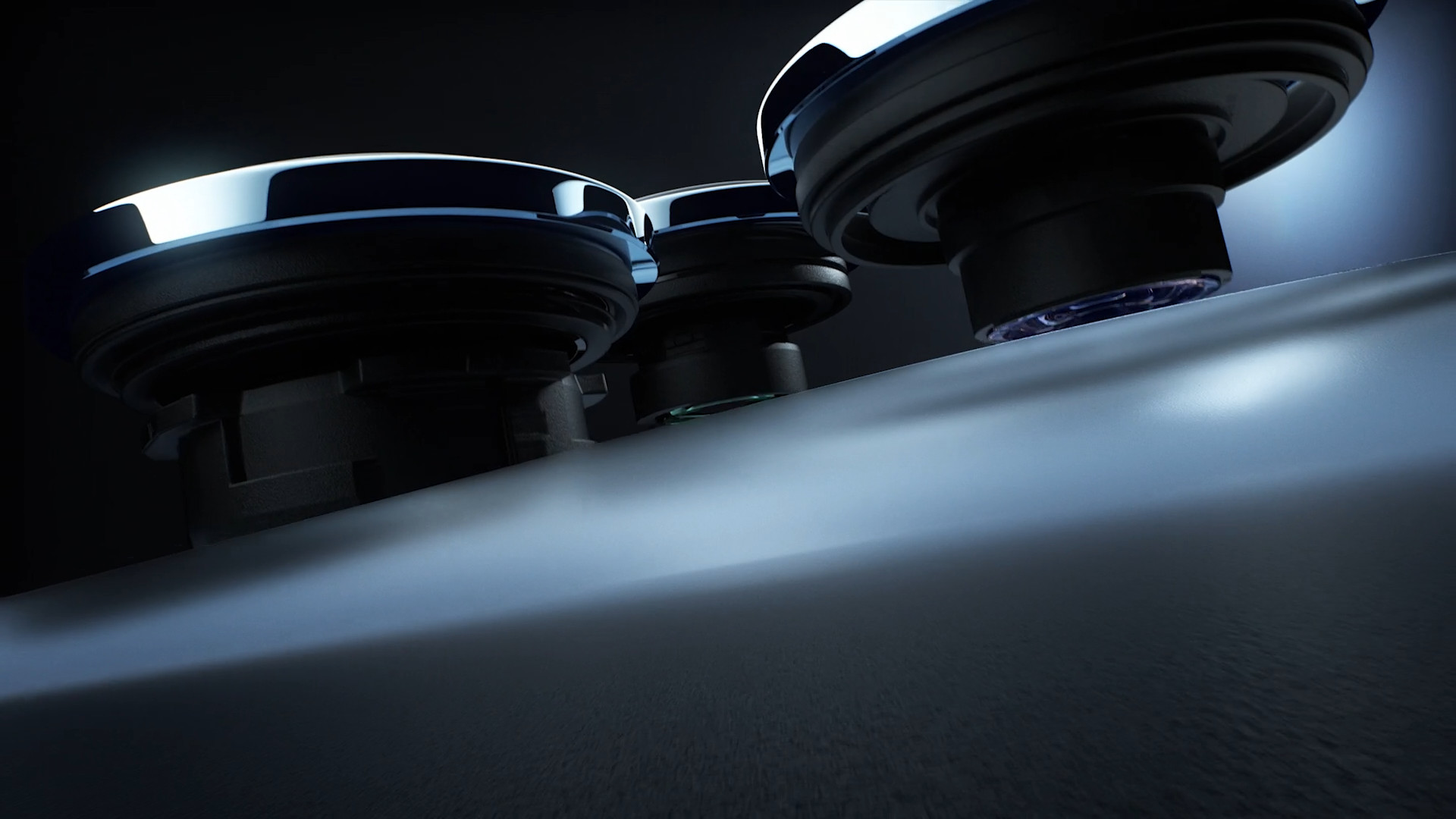 three camera lenses side view