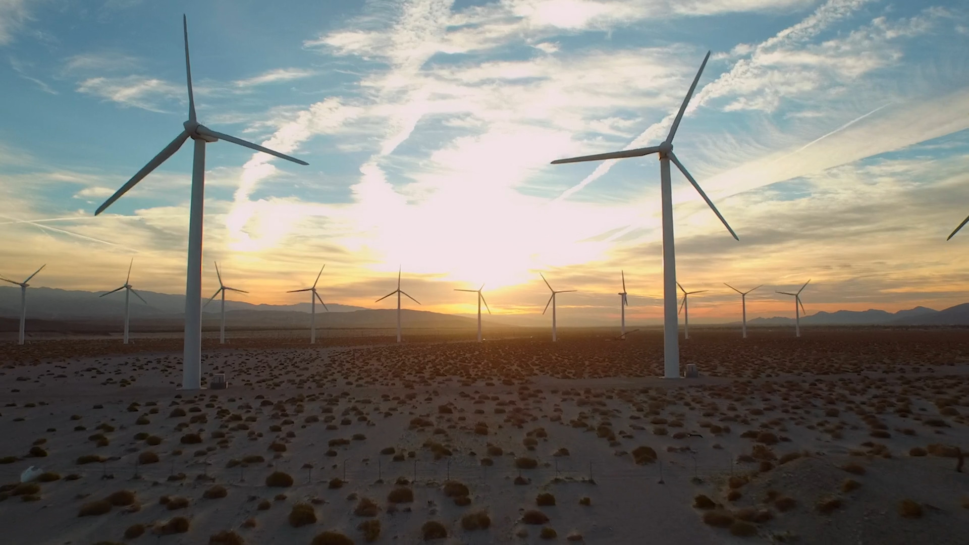 wind turbines desert sunset