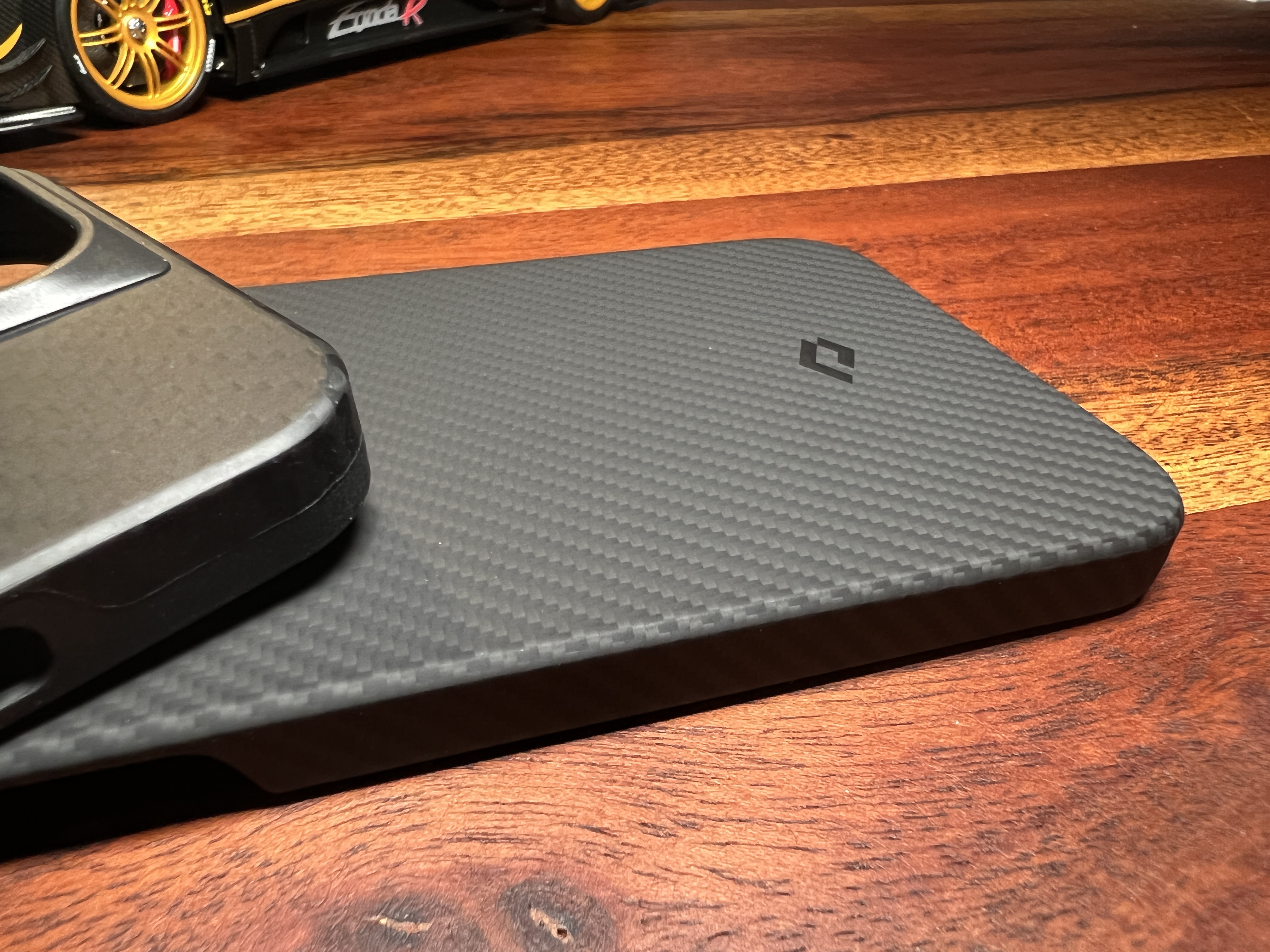 carbon fiber phone case on wood