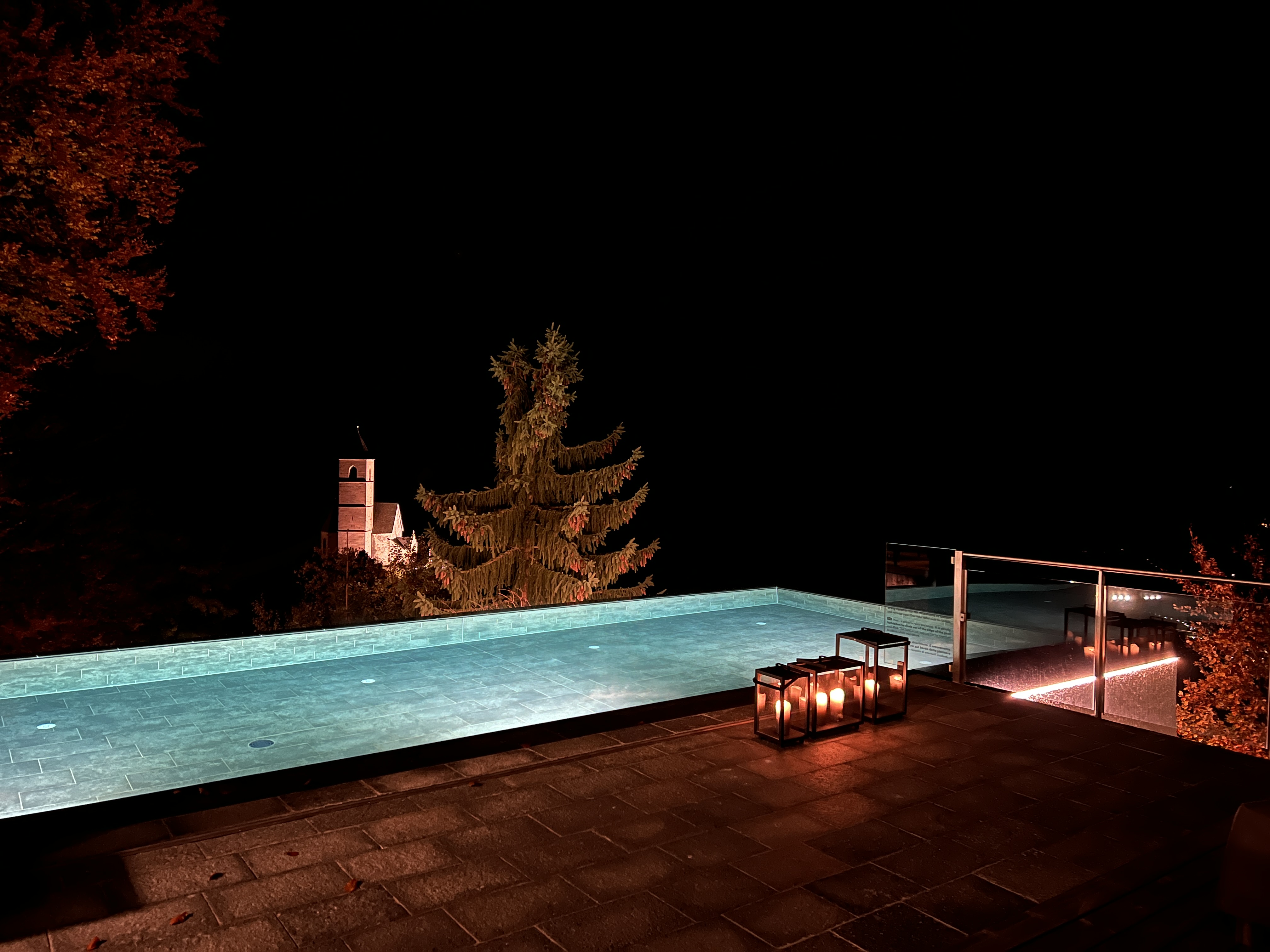 night poolside with lanterns