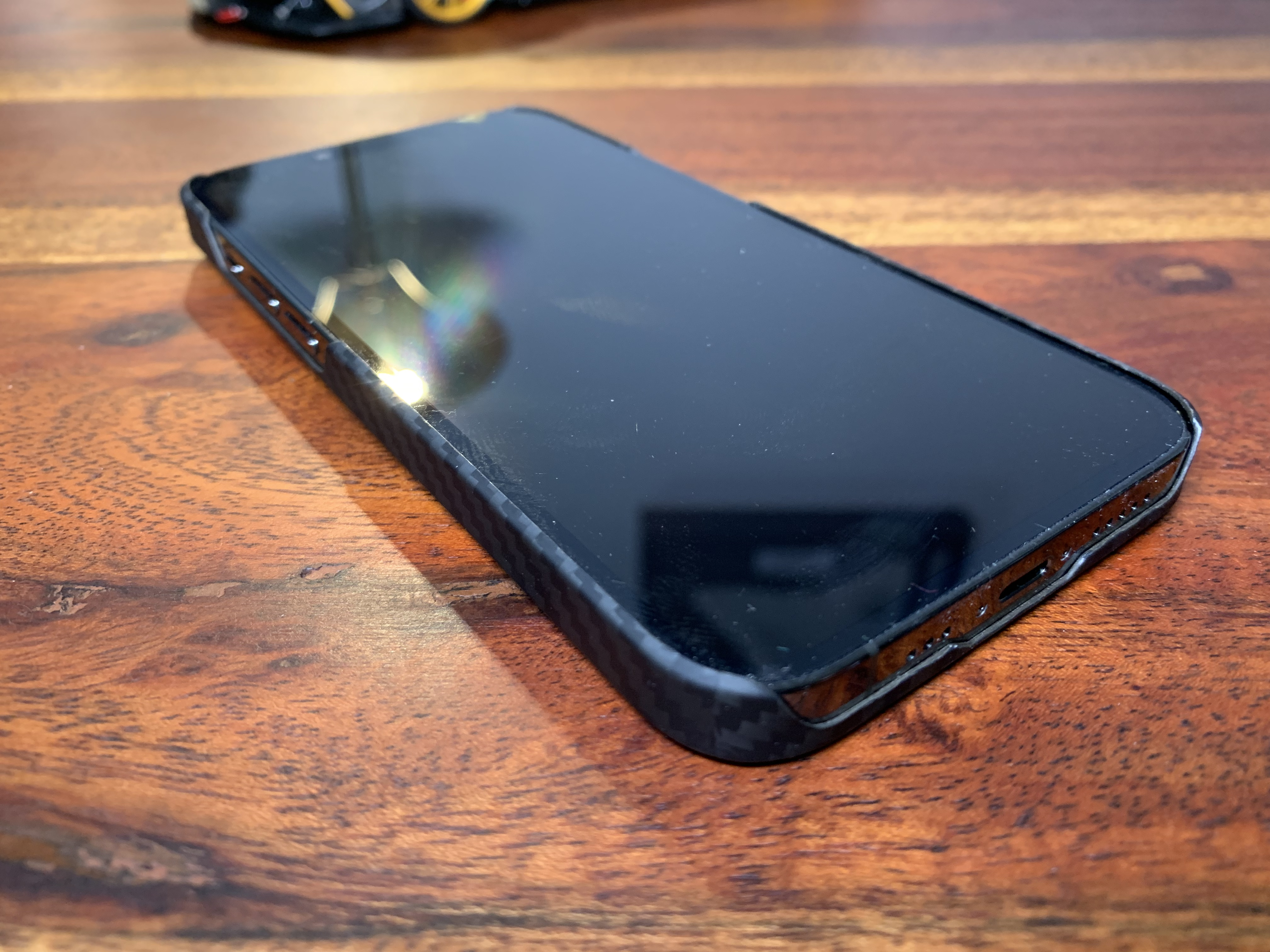 phone screen reflection on wooden table