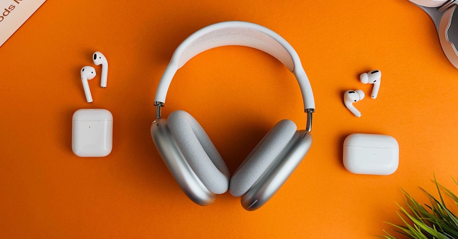 headphones and earbuds on orange