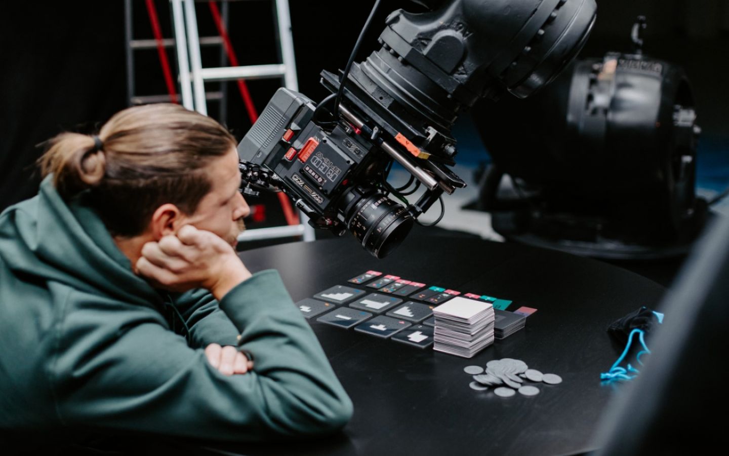 man with camera and cards
