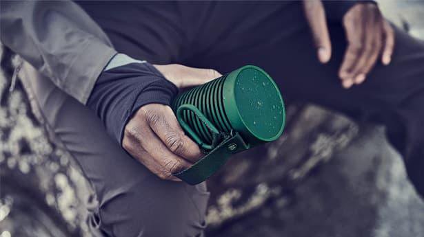 hand holding portable speaker