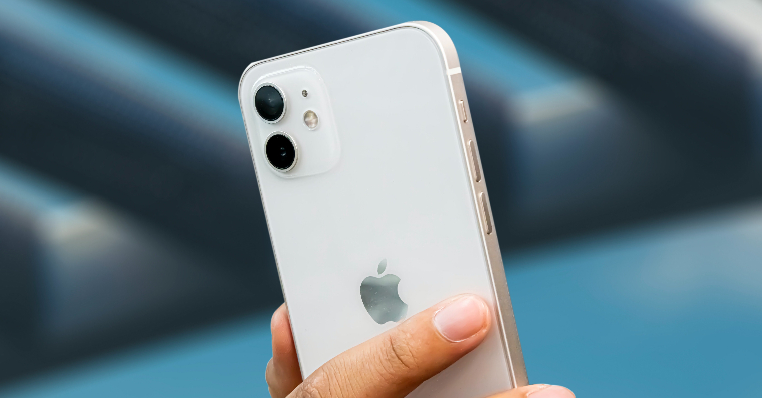 hand holding white iphone