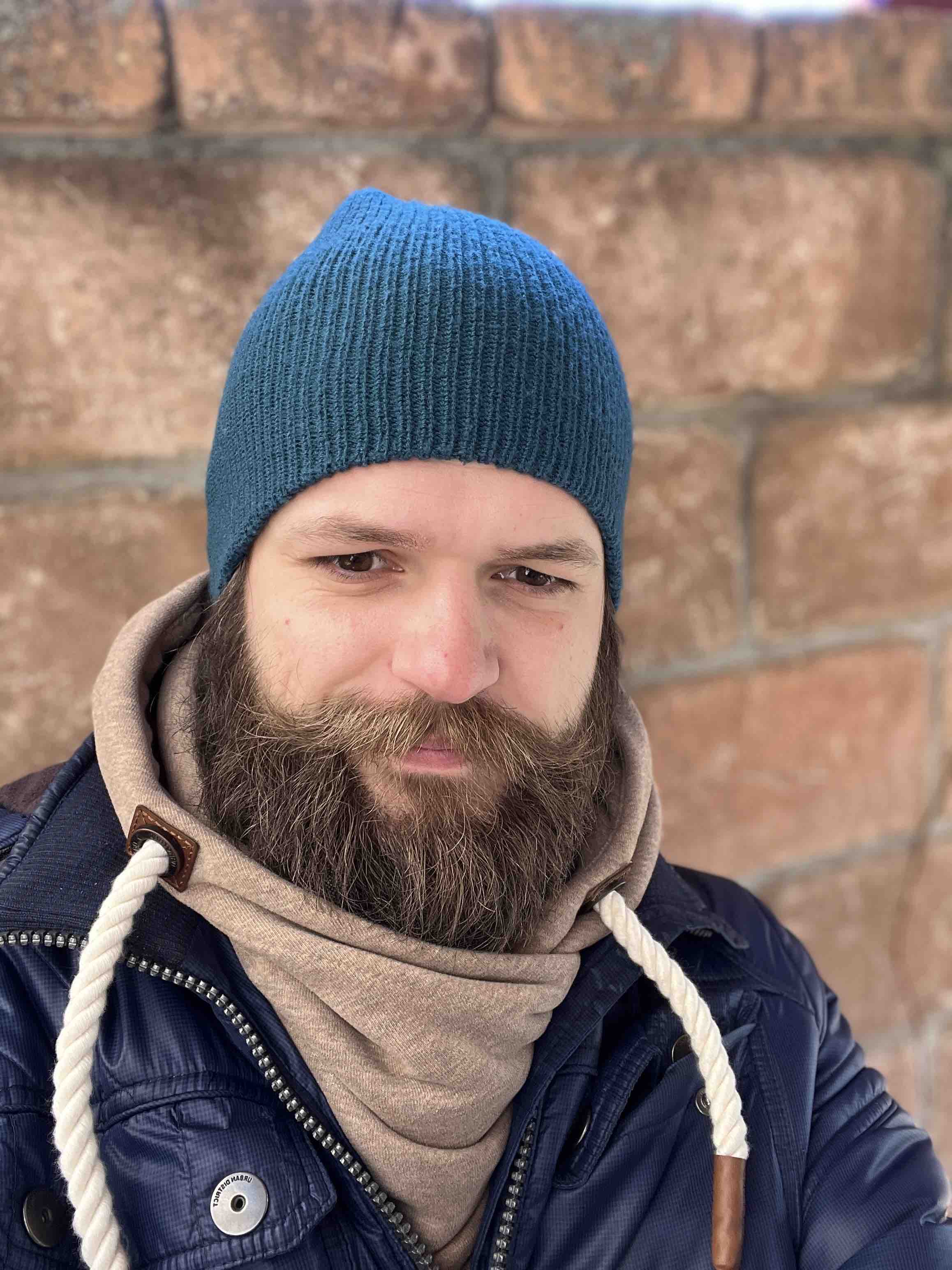 bearded man blue hat