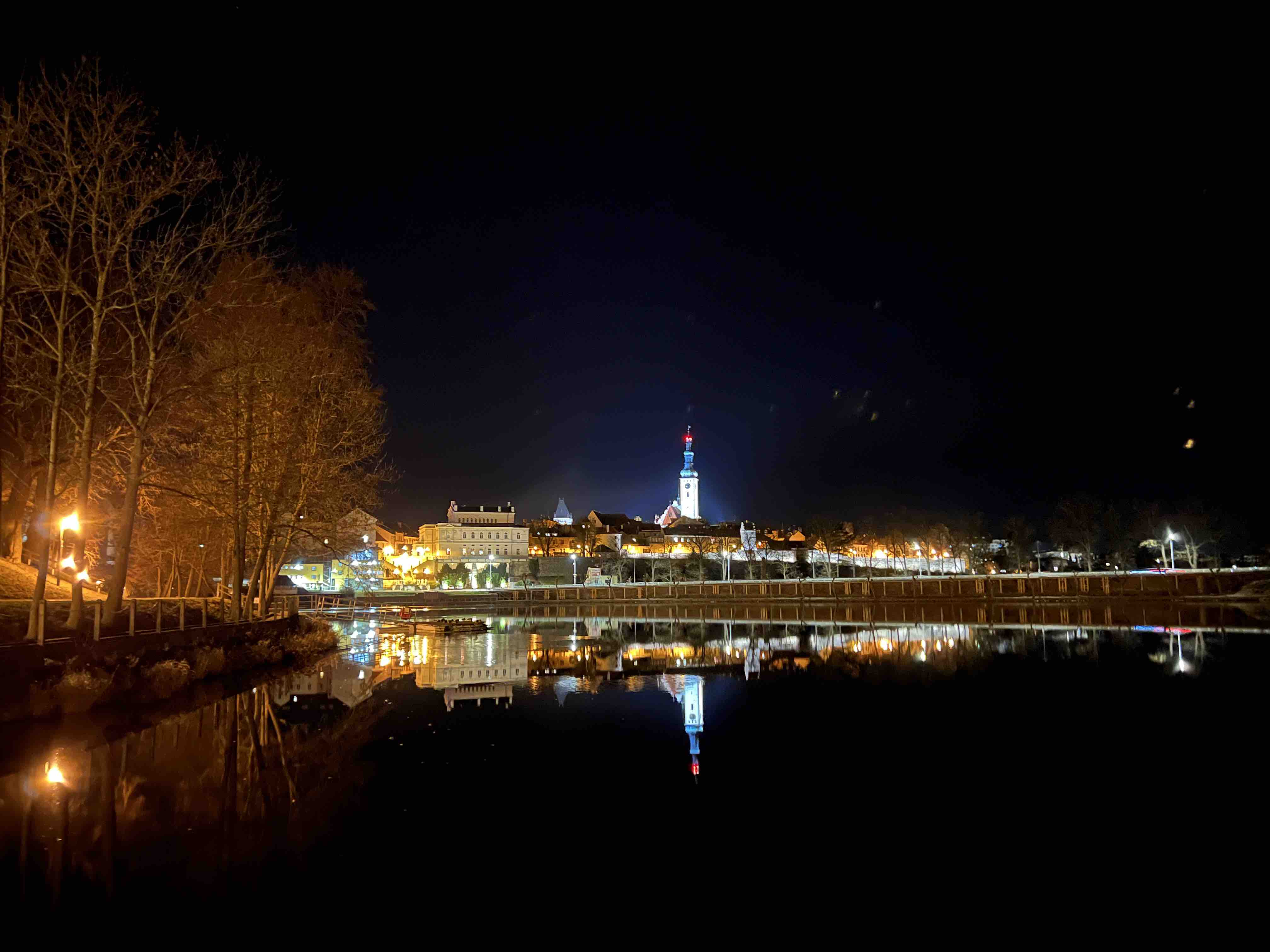 cityscape reflection on water at night