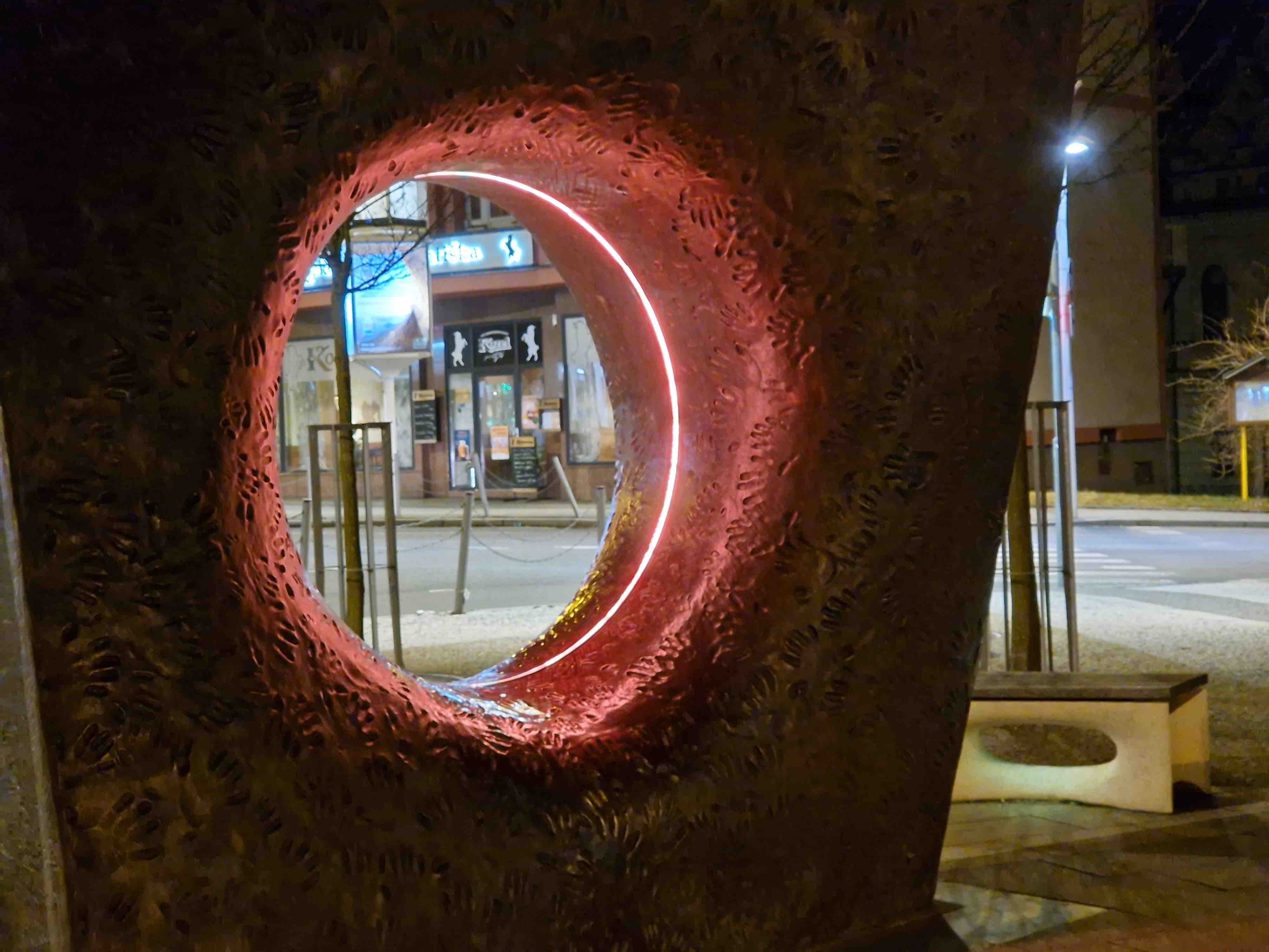 closeup of sculpture with red light