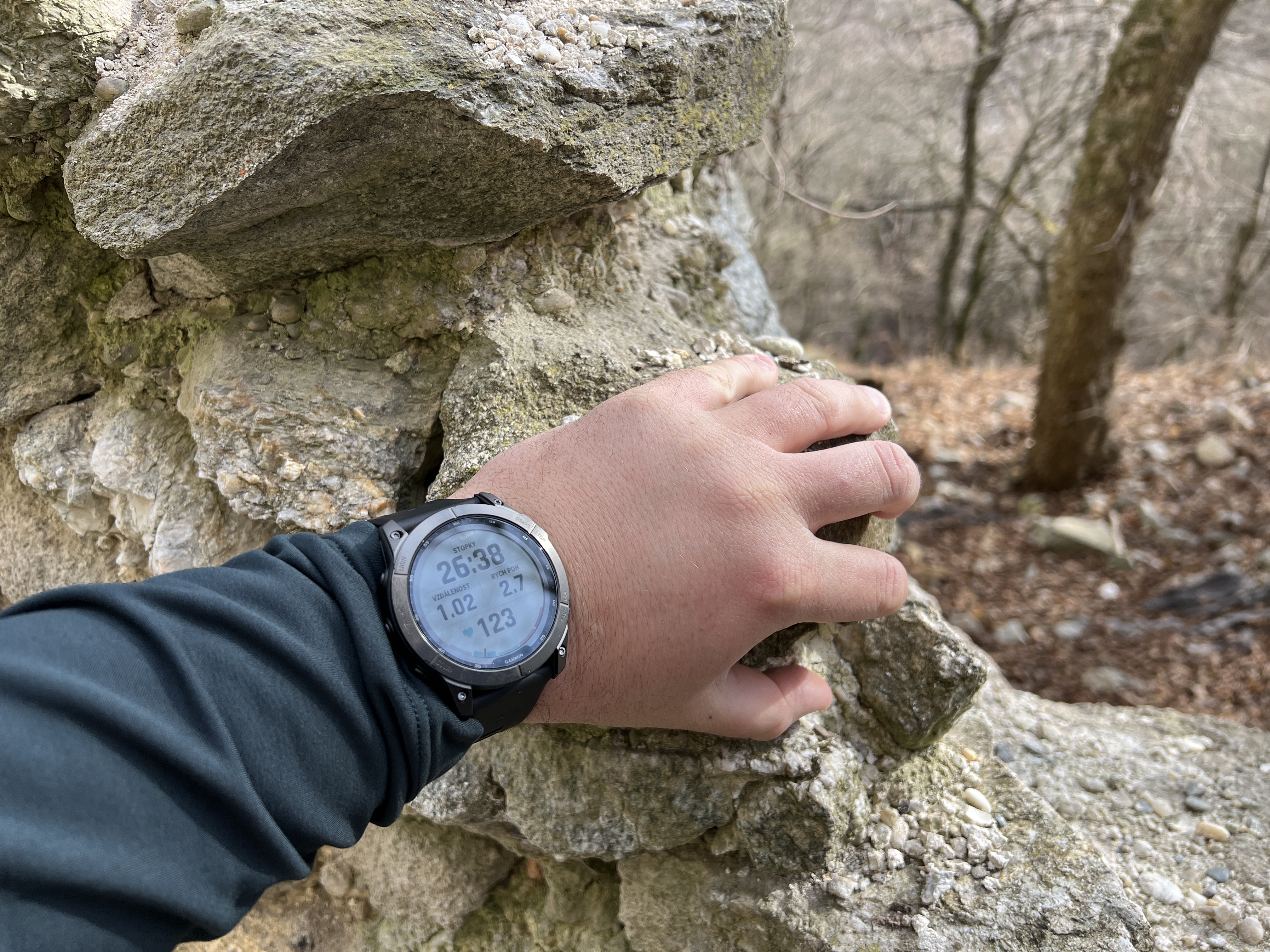 hand with watch on rock