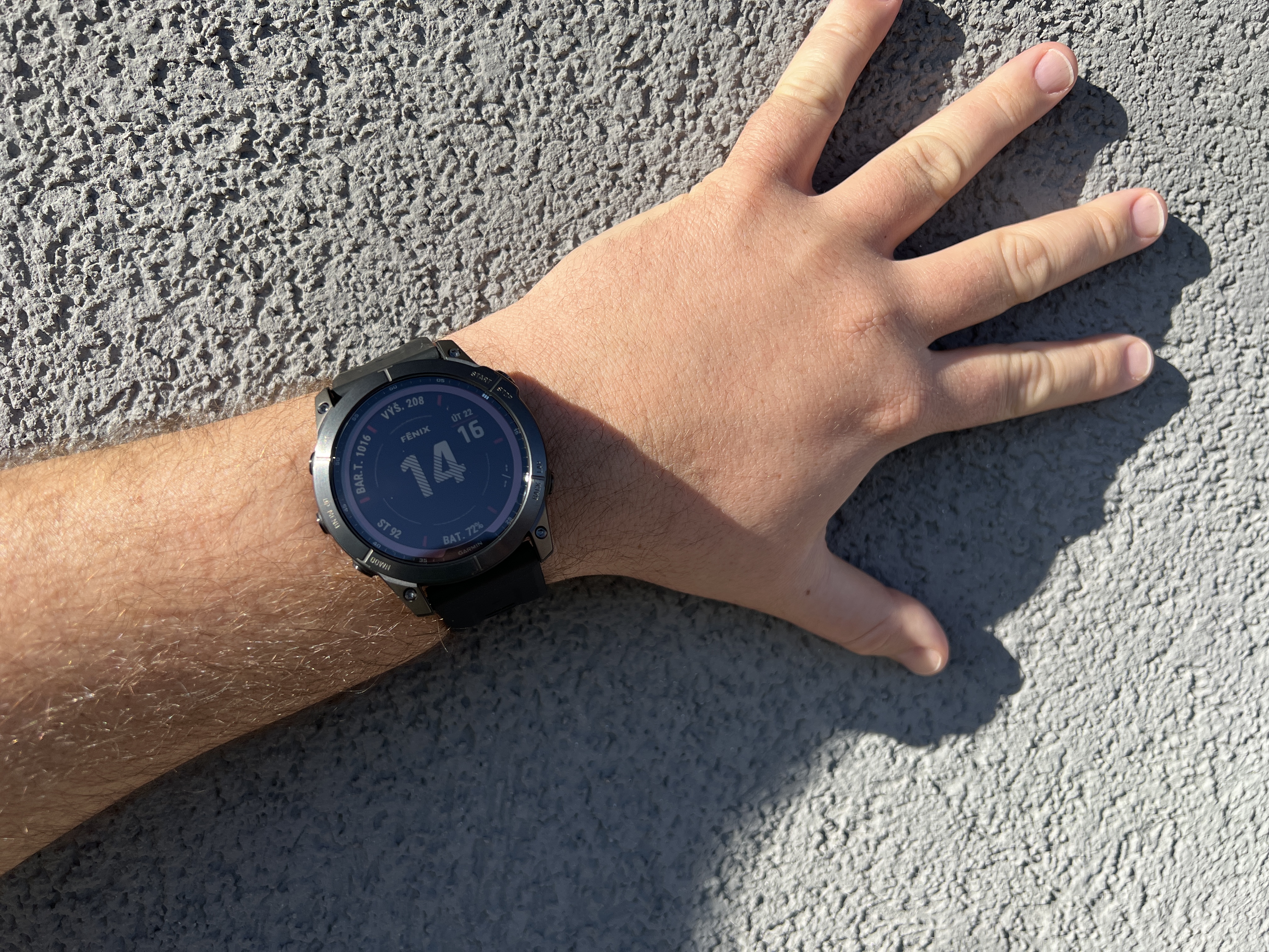 hand with watch on wall