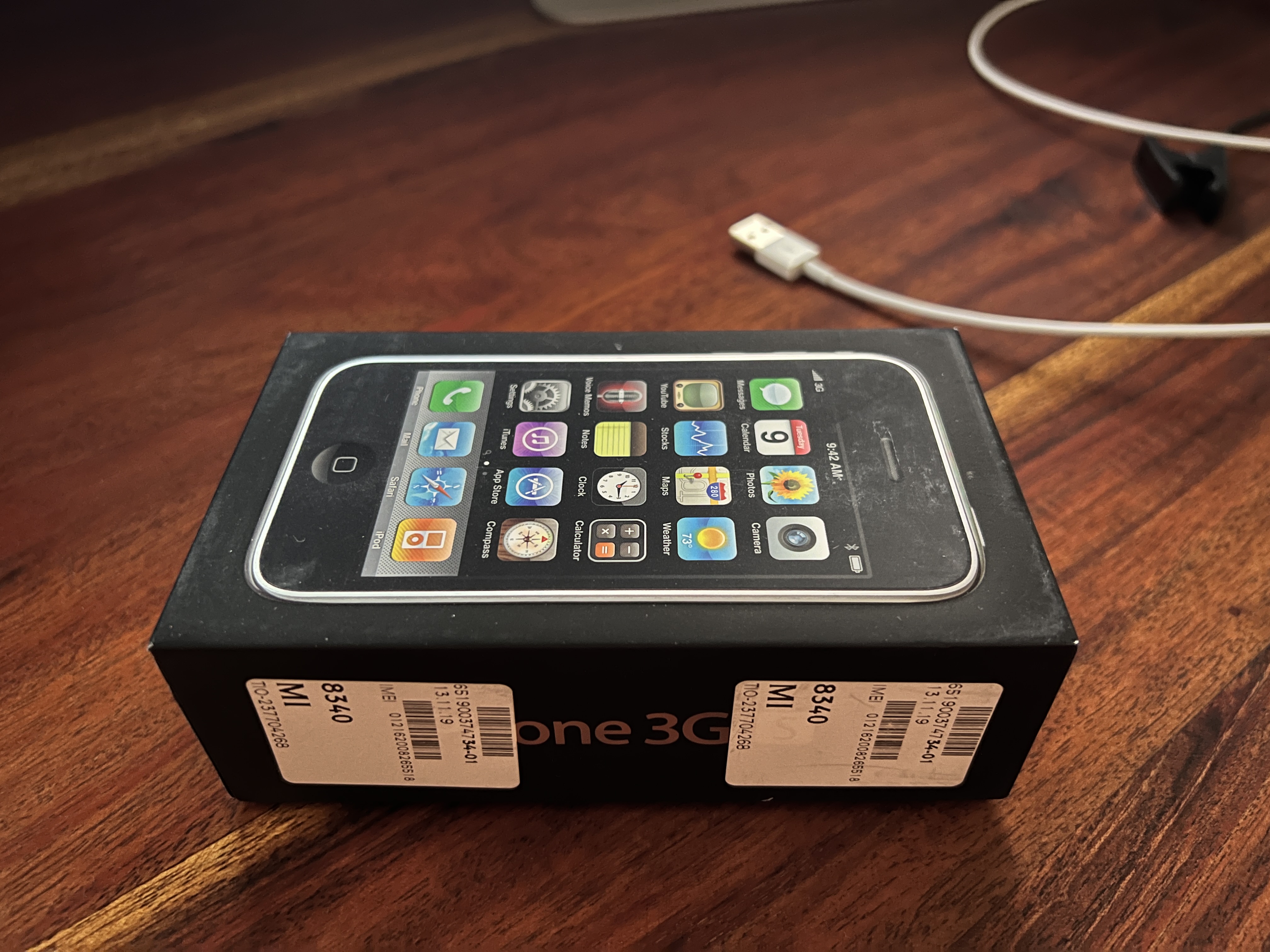 iphone 3g box on table