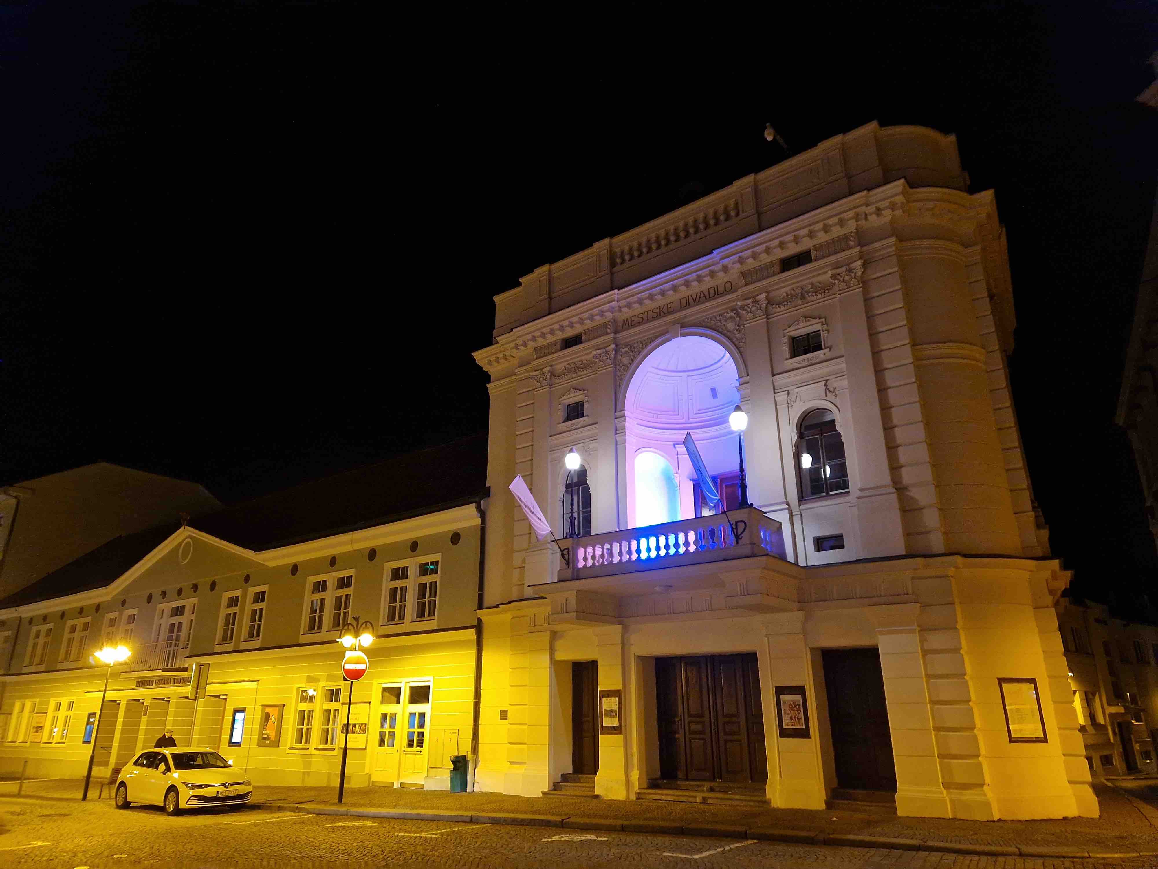 lit theater building at night