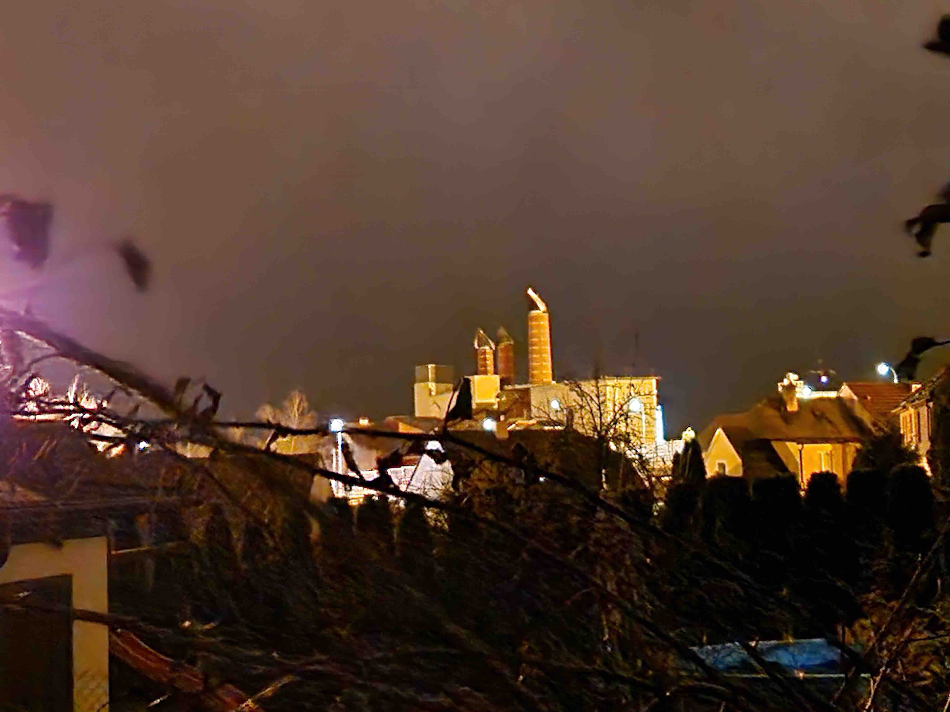 night industrial area with chimneys