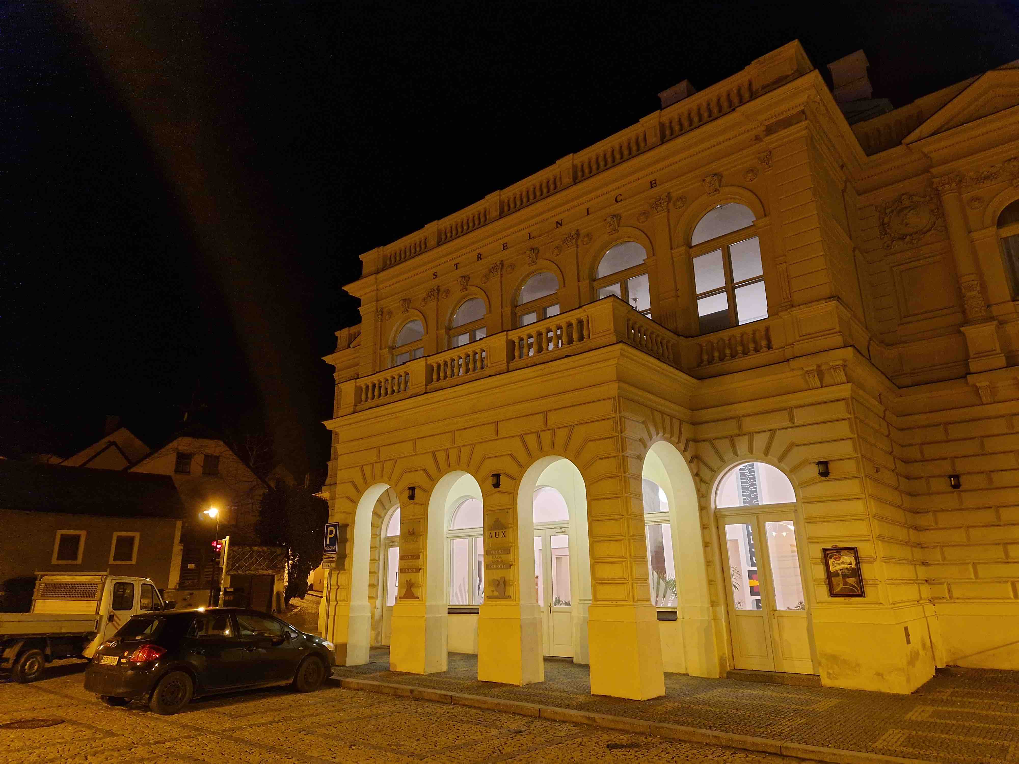 nighttime building with arches