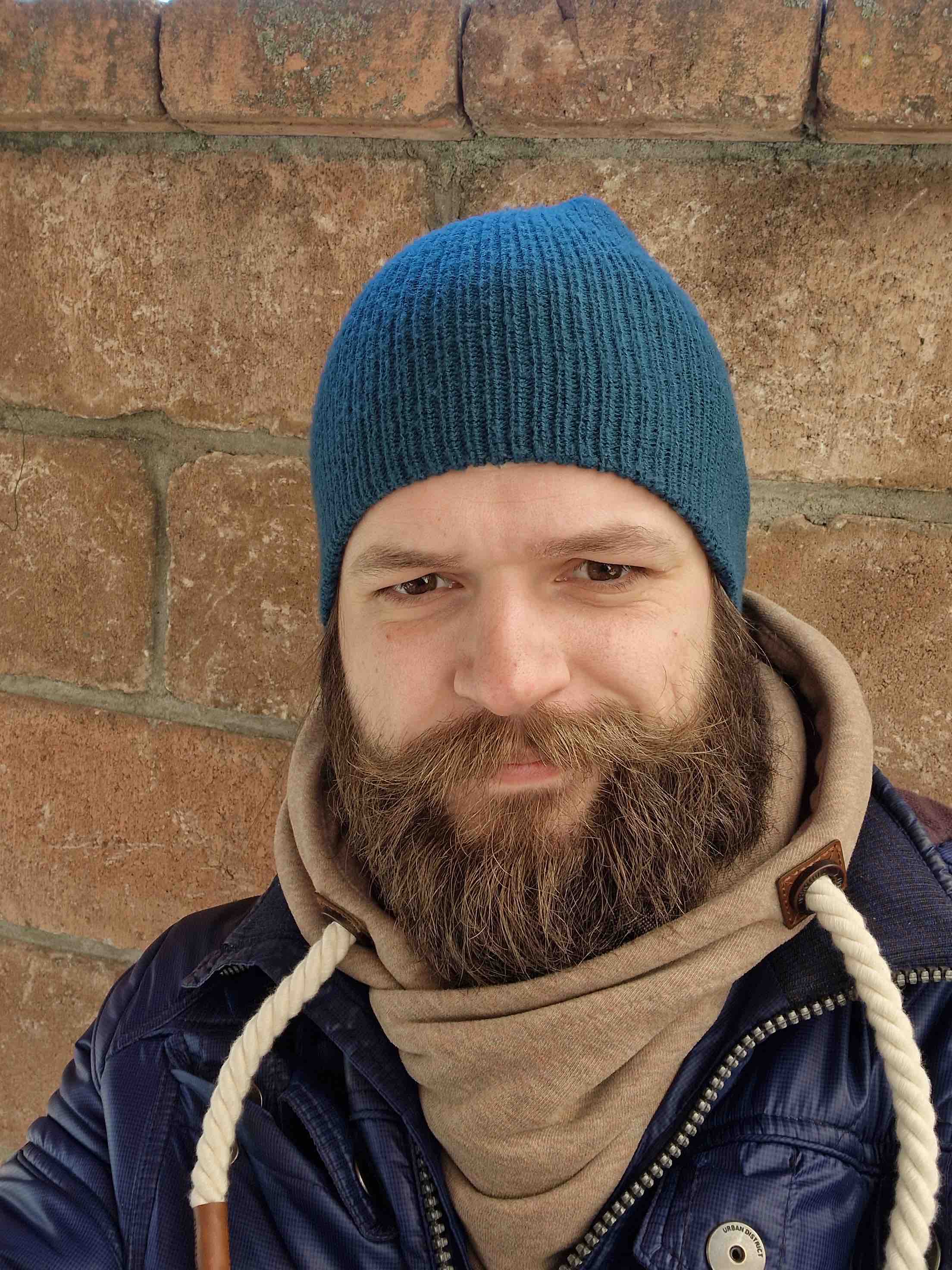 person blue beanie closeup