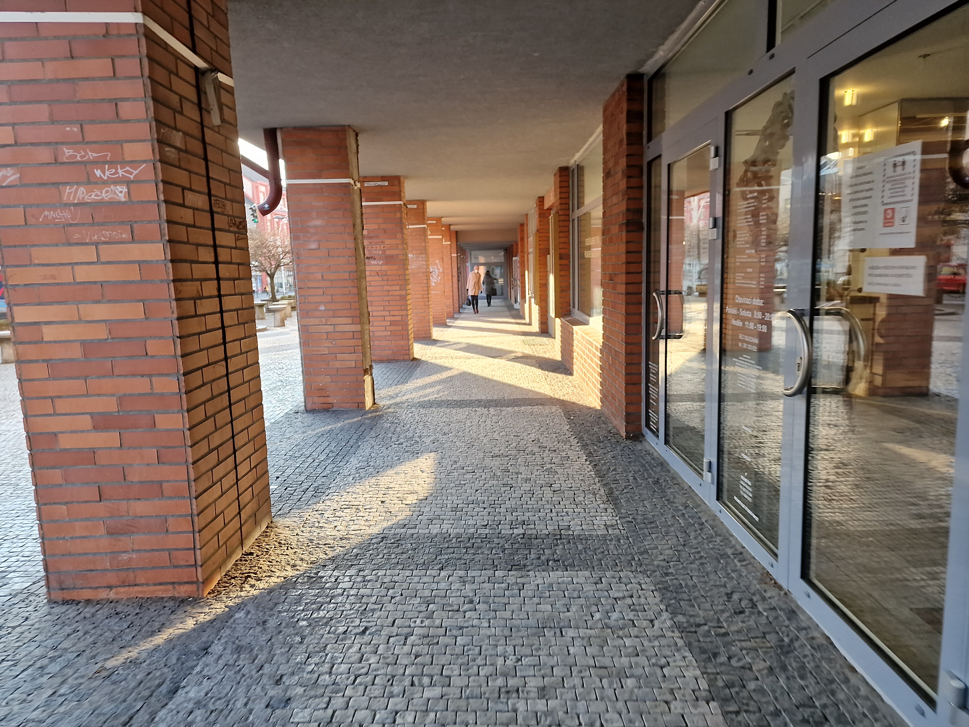 brick arcade with glass doors