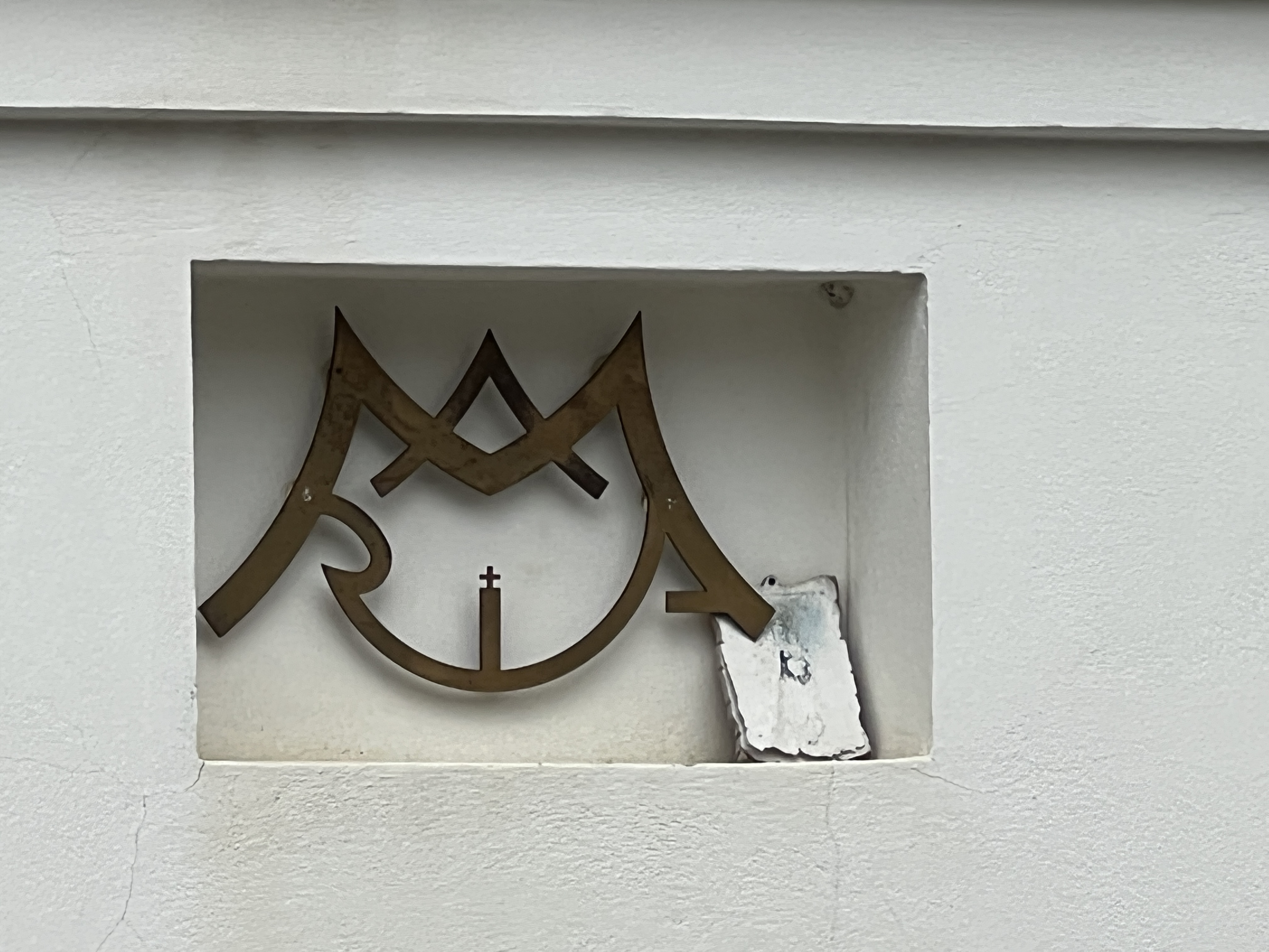 closeup symbol white wall