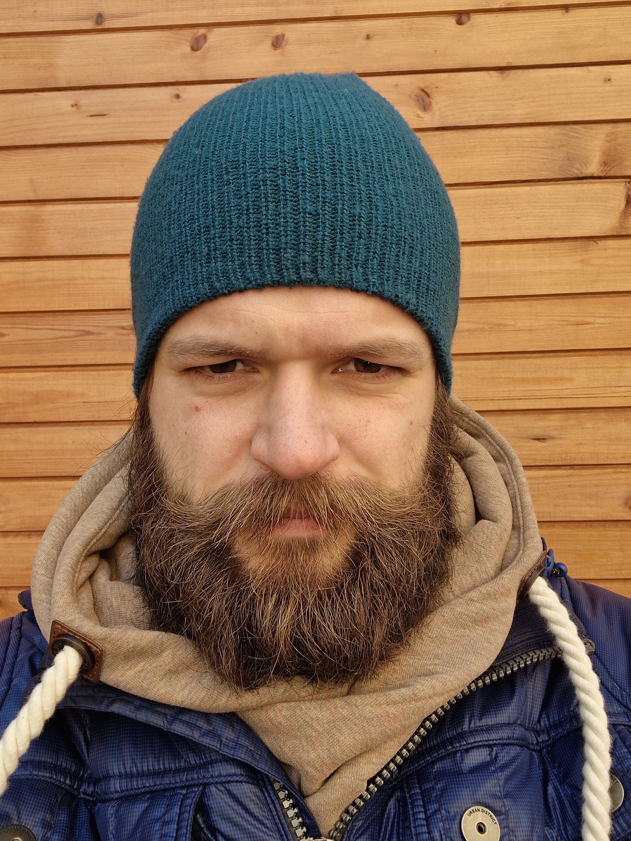 man in blue jacket and beanie