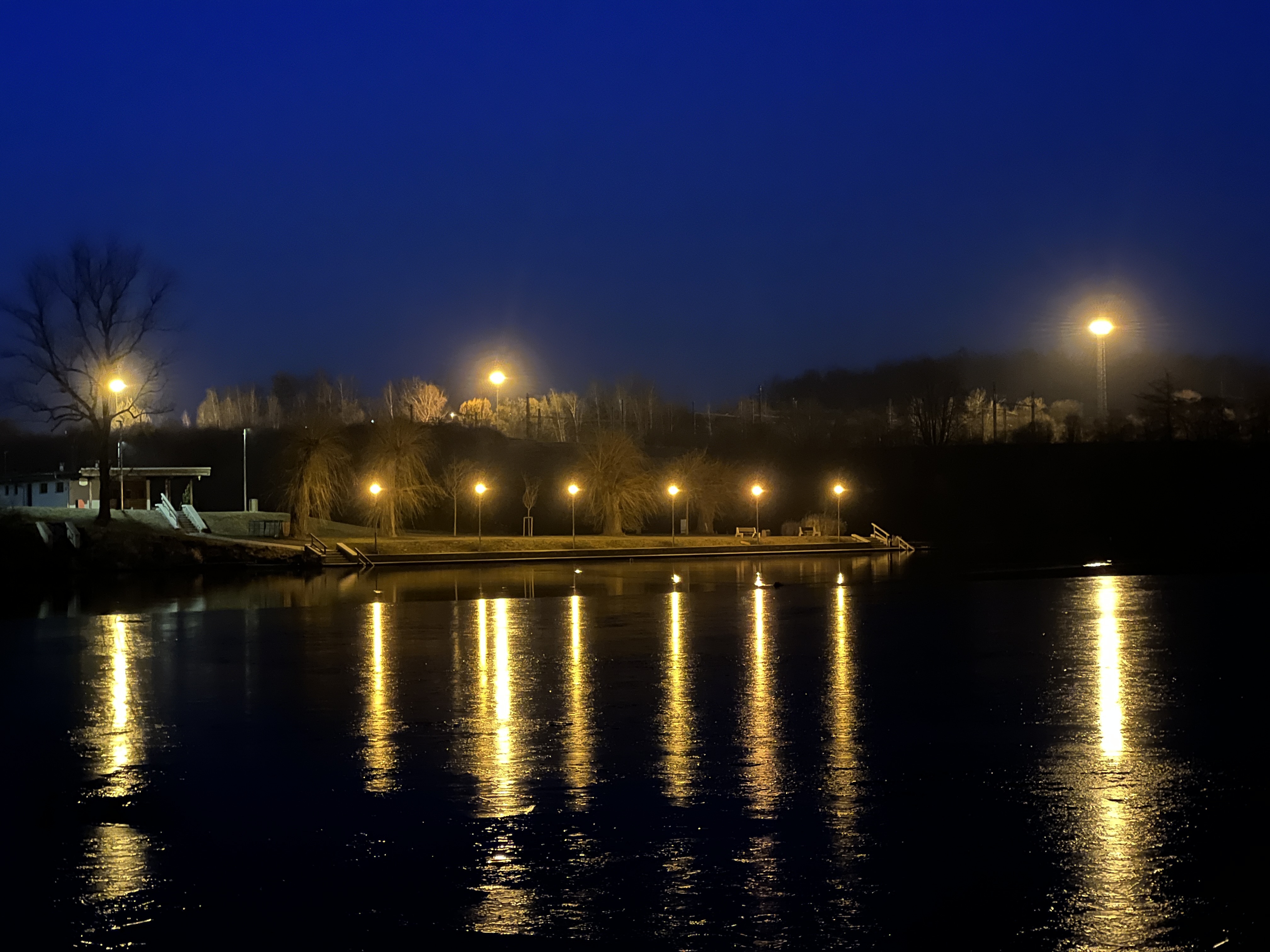 streetlights river reflection