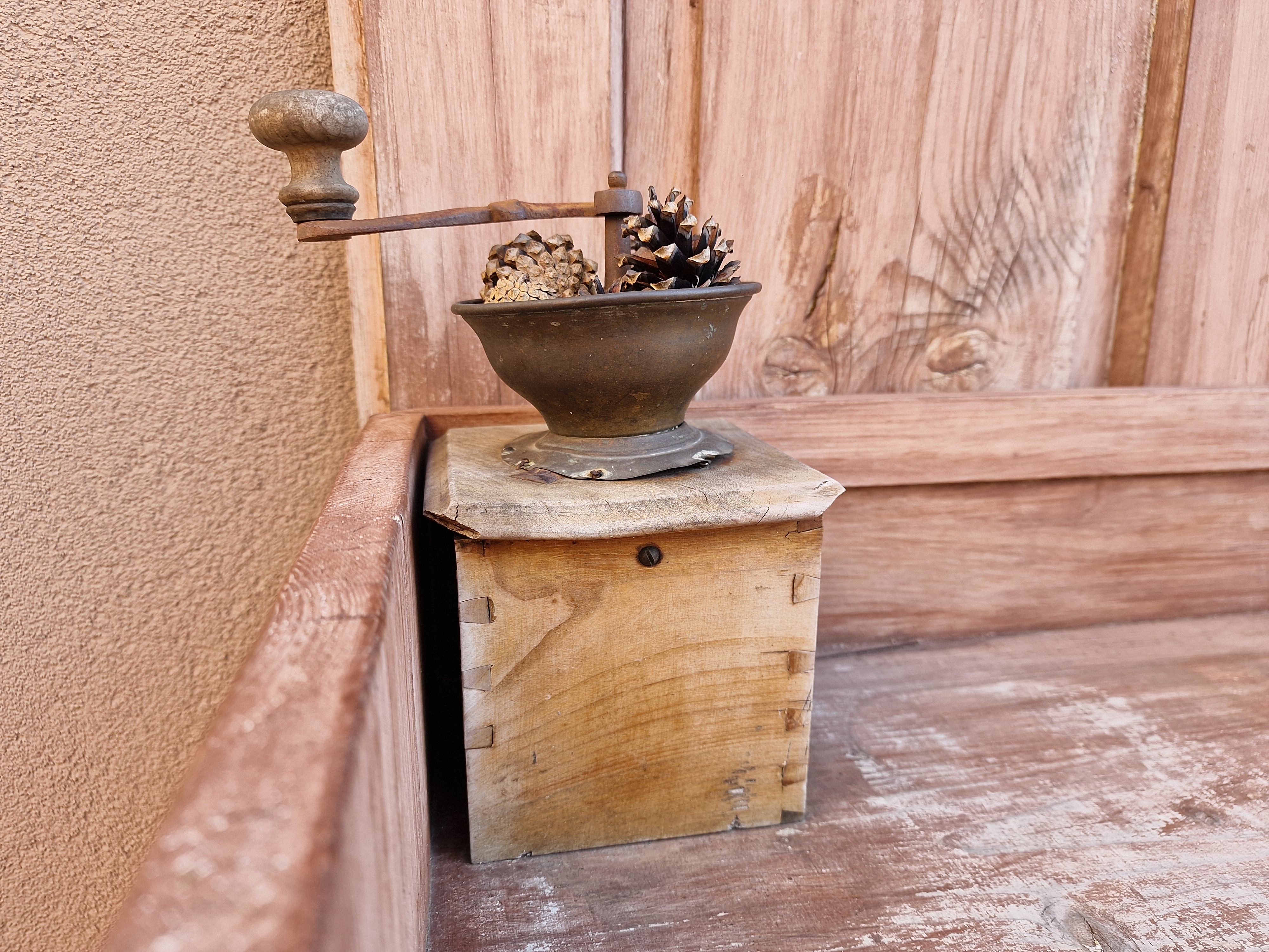 vintage coffee grinder on wooden surface