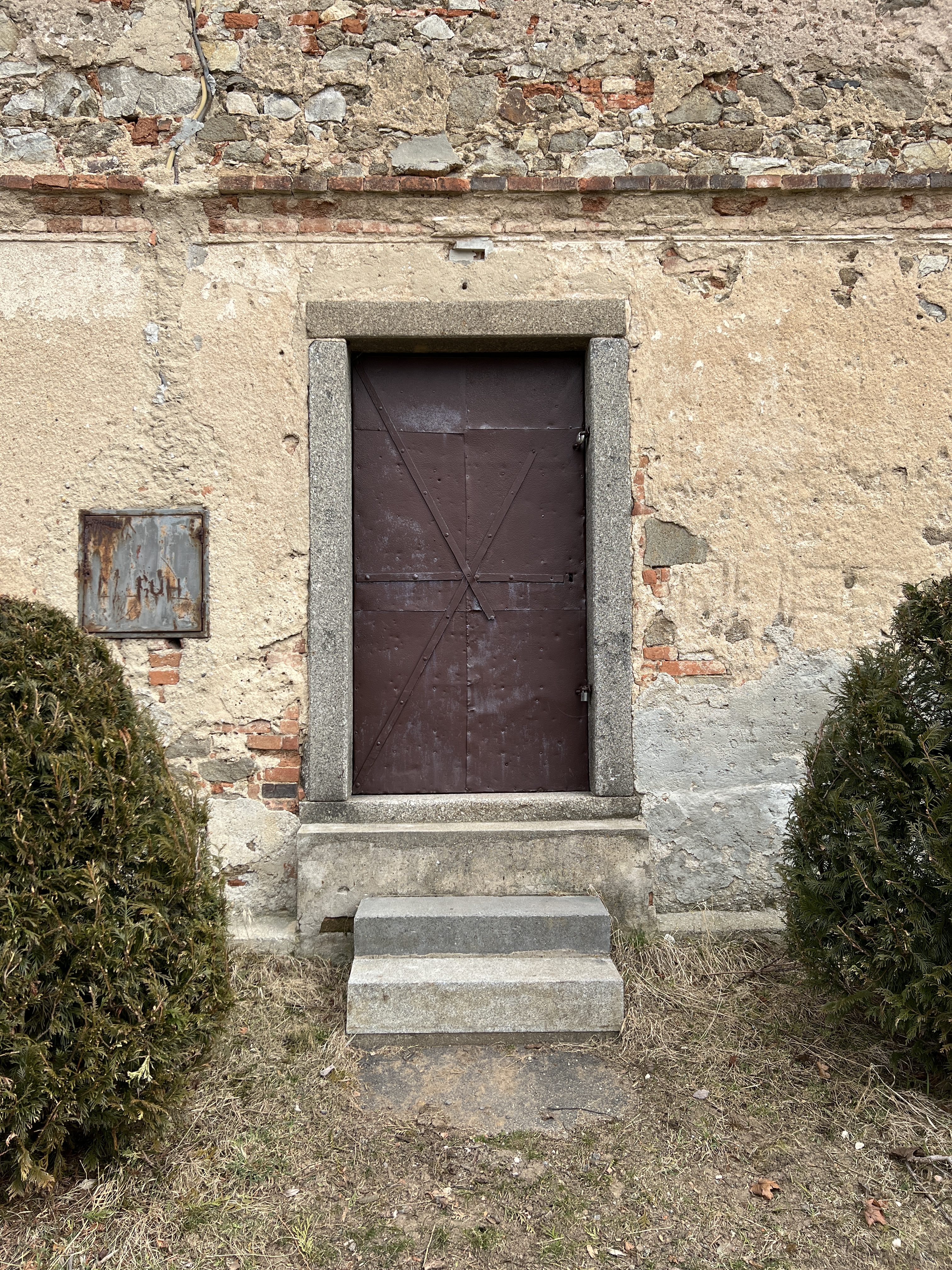 weathered door brick wall