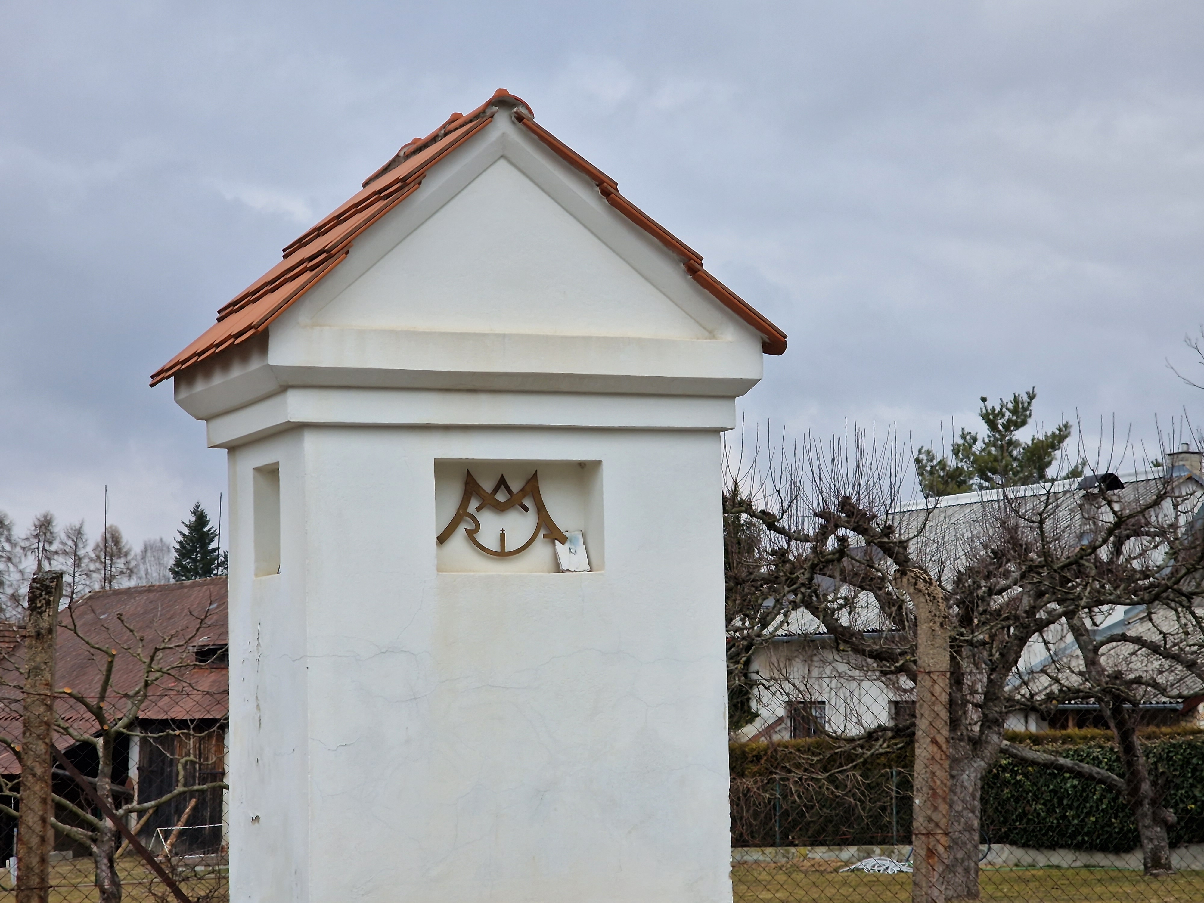 white structure with symbol