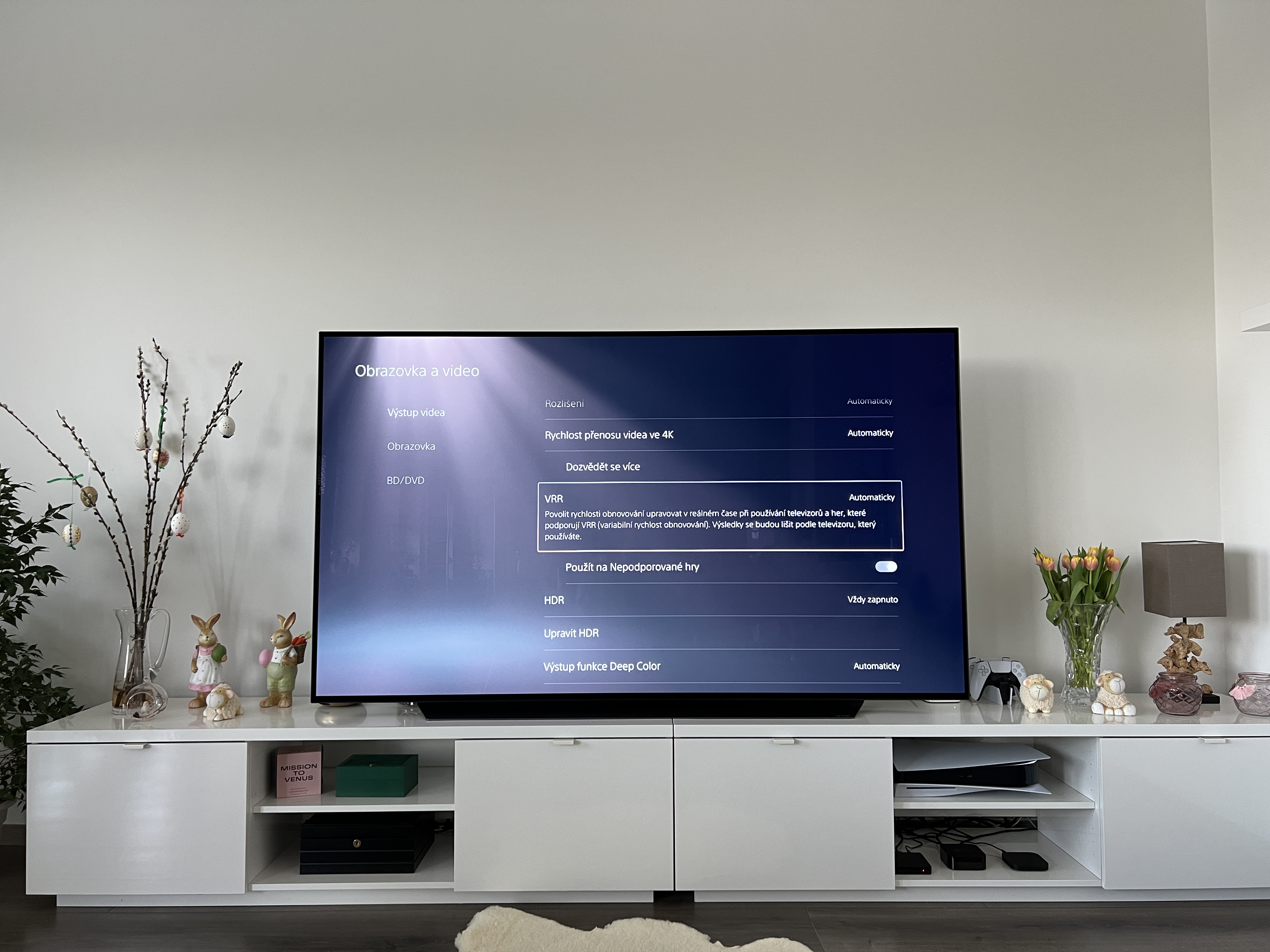 large tv on white cabinet
