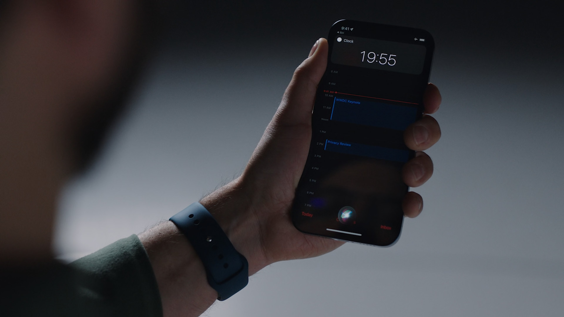 hand holding smartphone clock app