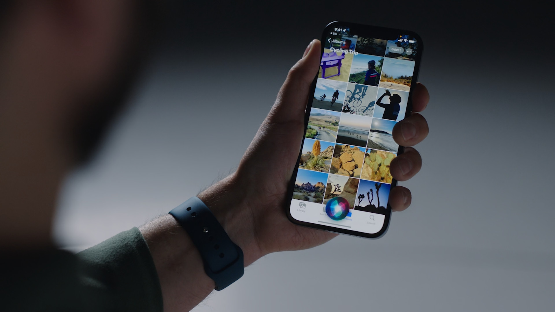 hand holding smartphone photo gallery