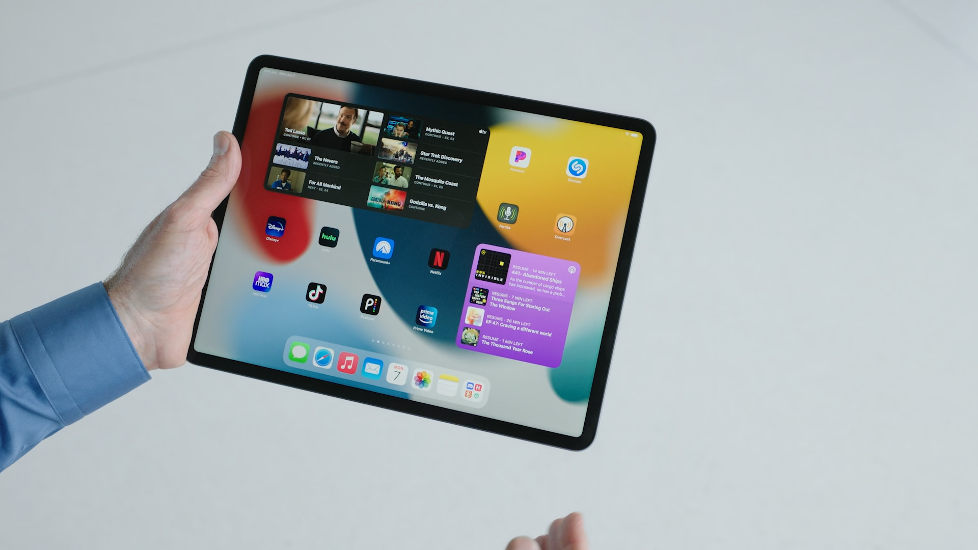 person holding ipad memoji screen